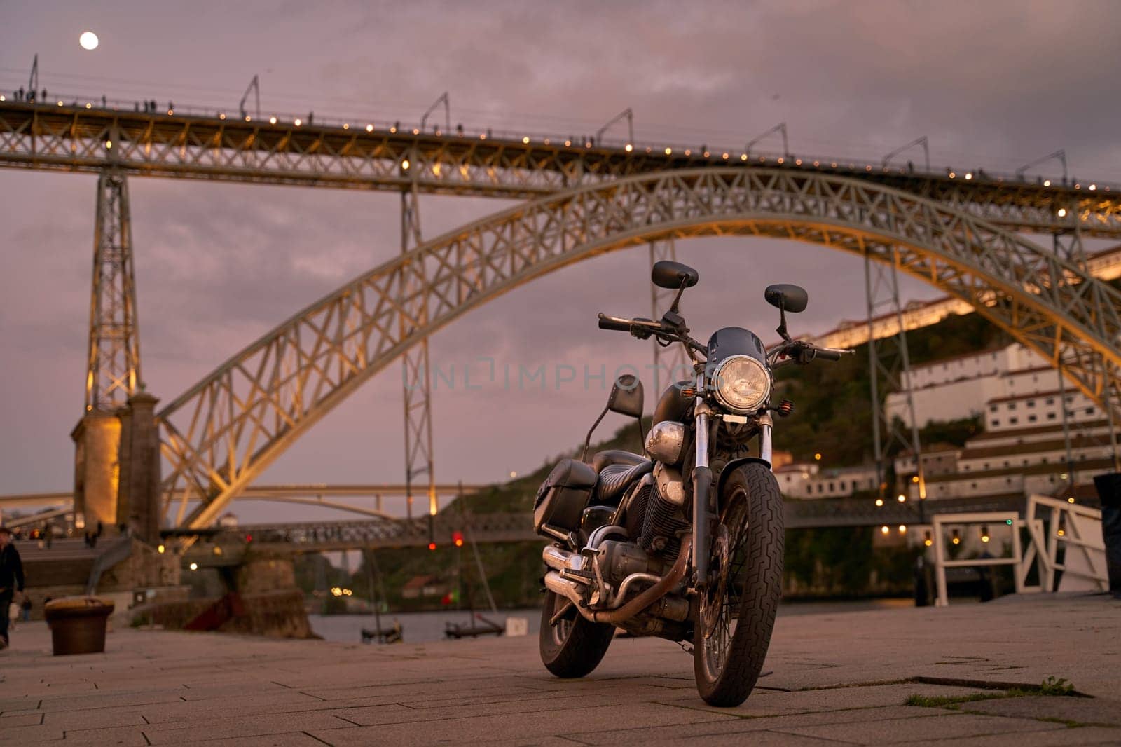 Old bike on background of the Dom Luis I Bridge in Porto, Portugal
