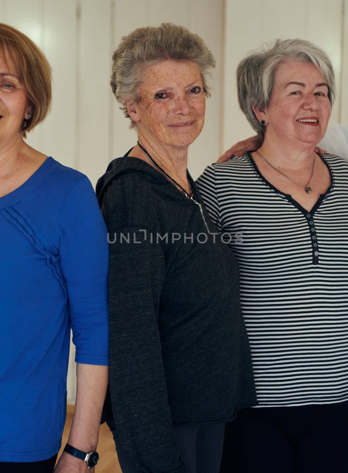 A vibrant community of senior women, guided by their instructor, embraces the enriching journey of yoga, fostering unity, well-being, and a shared commitment to active aging by dotshock