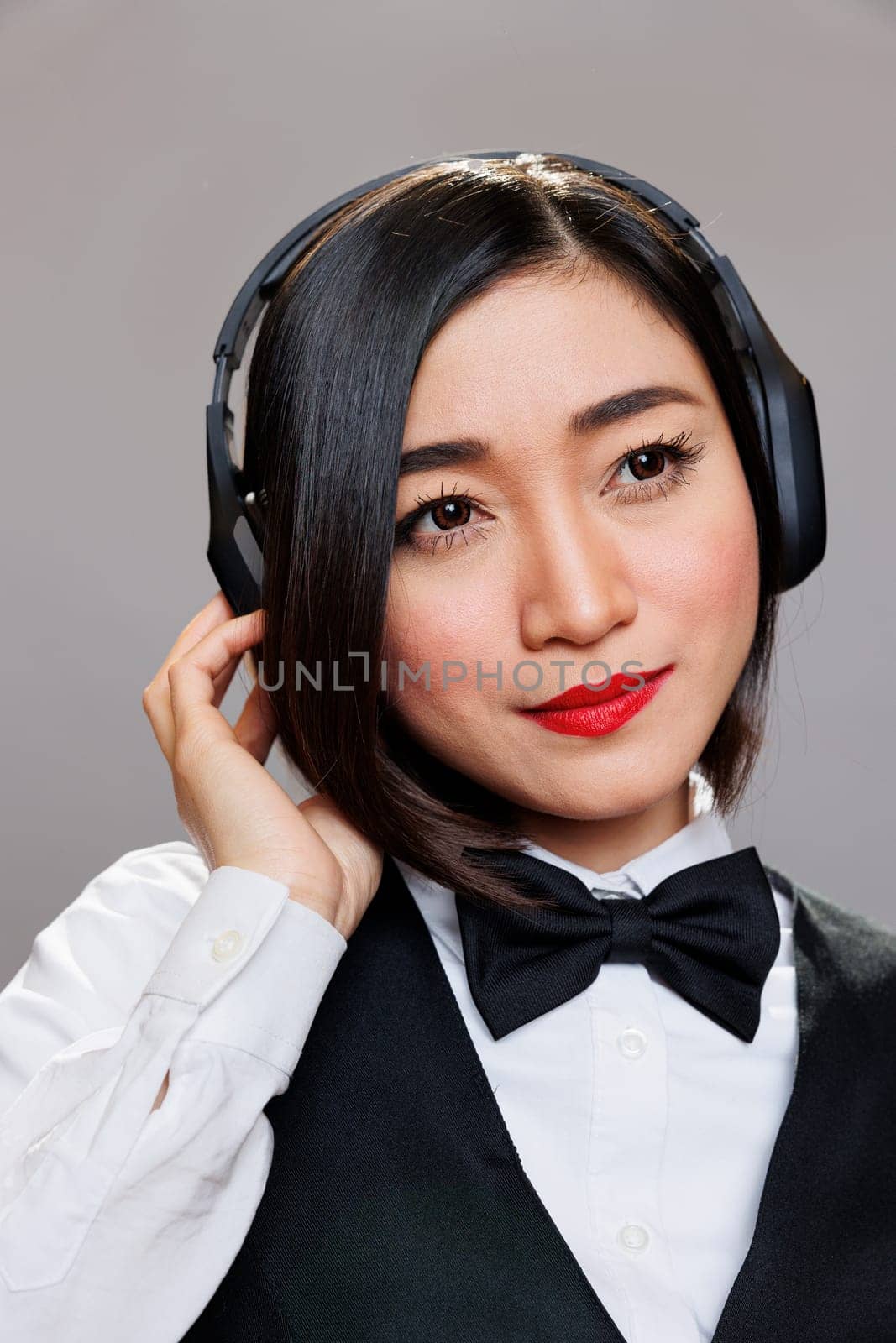 Waitress enjoying song in headphones by DCStudio