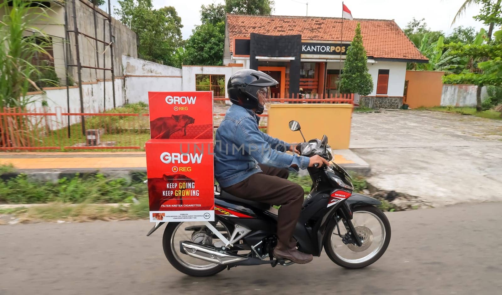 motorbike riding in asia as one of goods transportation method, being used to transport many kind of goods intercity by antoksena