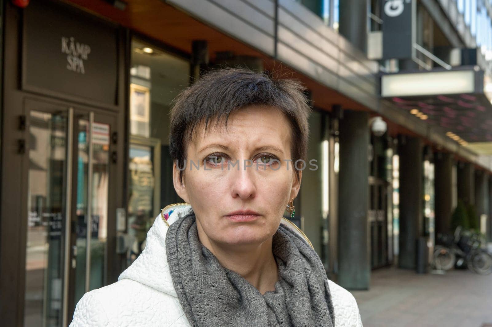 portrait of a woman in a white jacket in Helsinki 2 by Mixa74