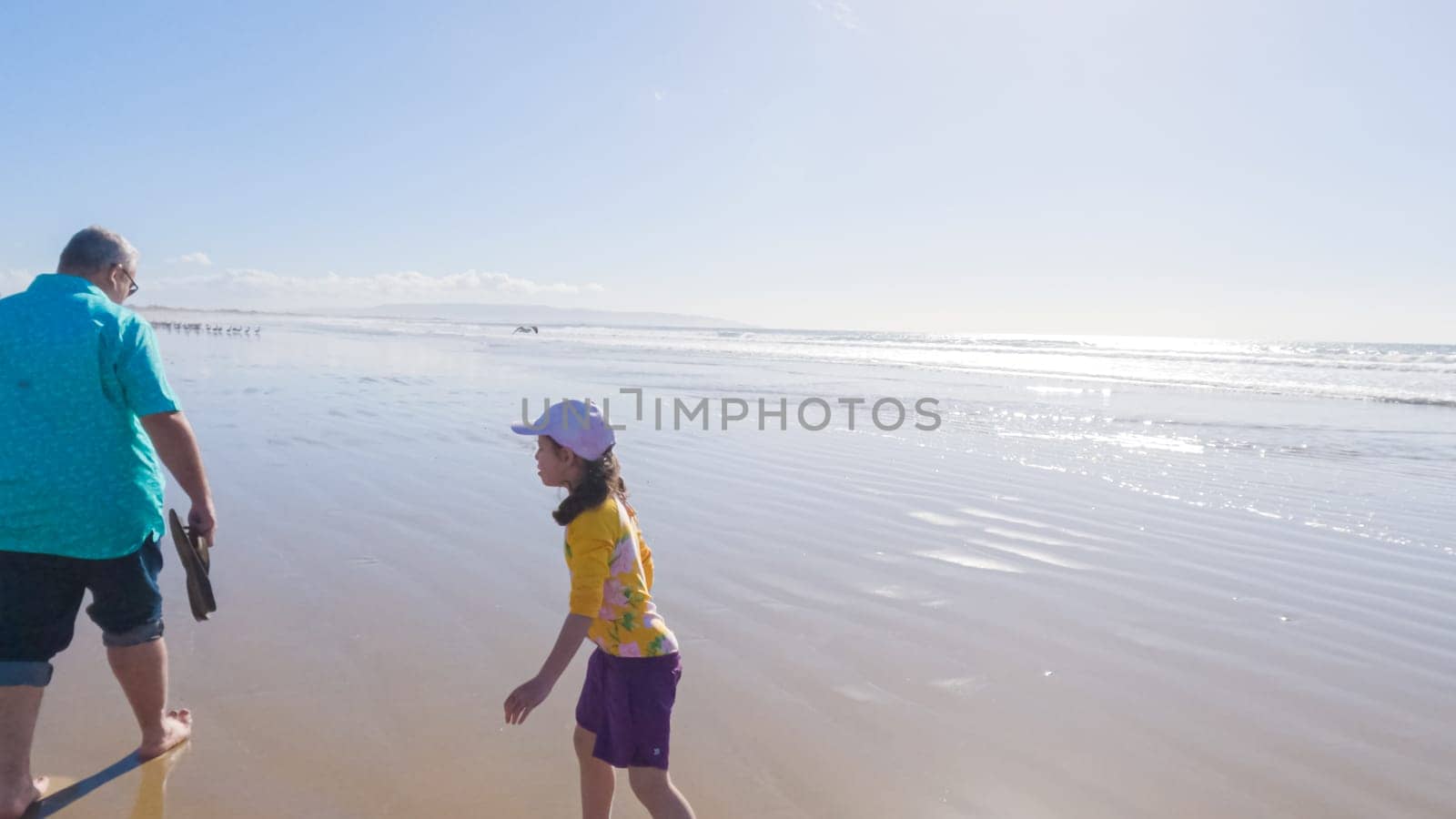 Father and Daughter Winter Stroll on Pismo Beach by arinahabich