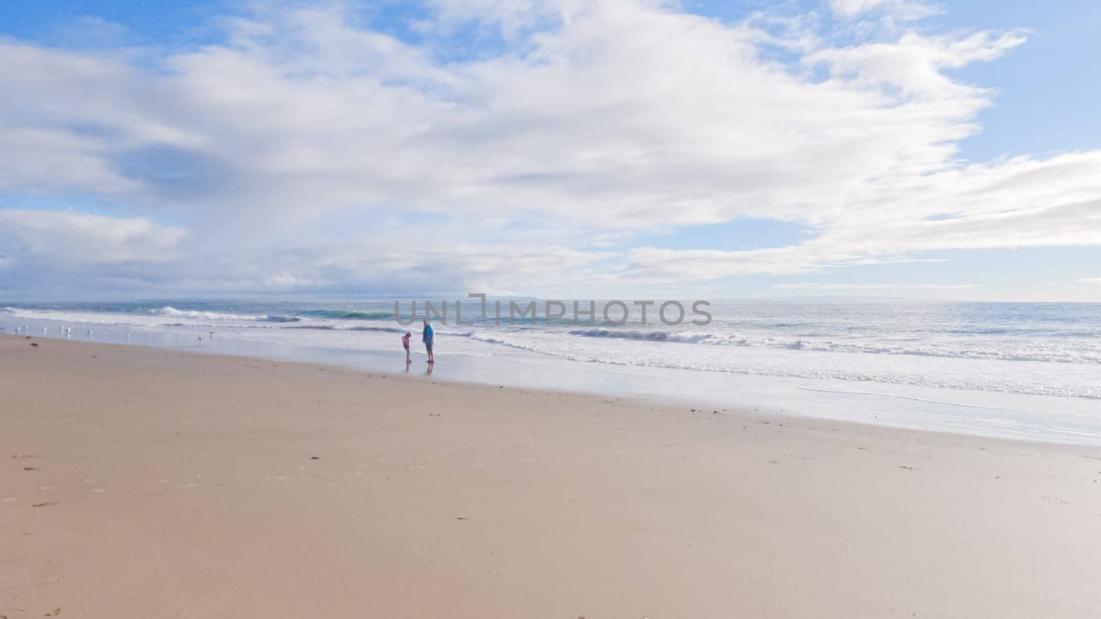 Father, Daughter Stroll El Capitan Beach, California by arinahabich