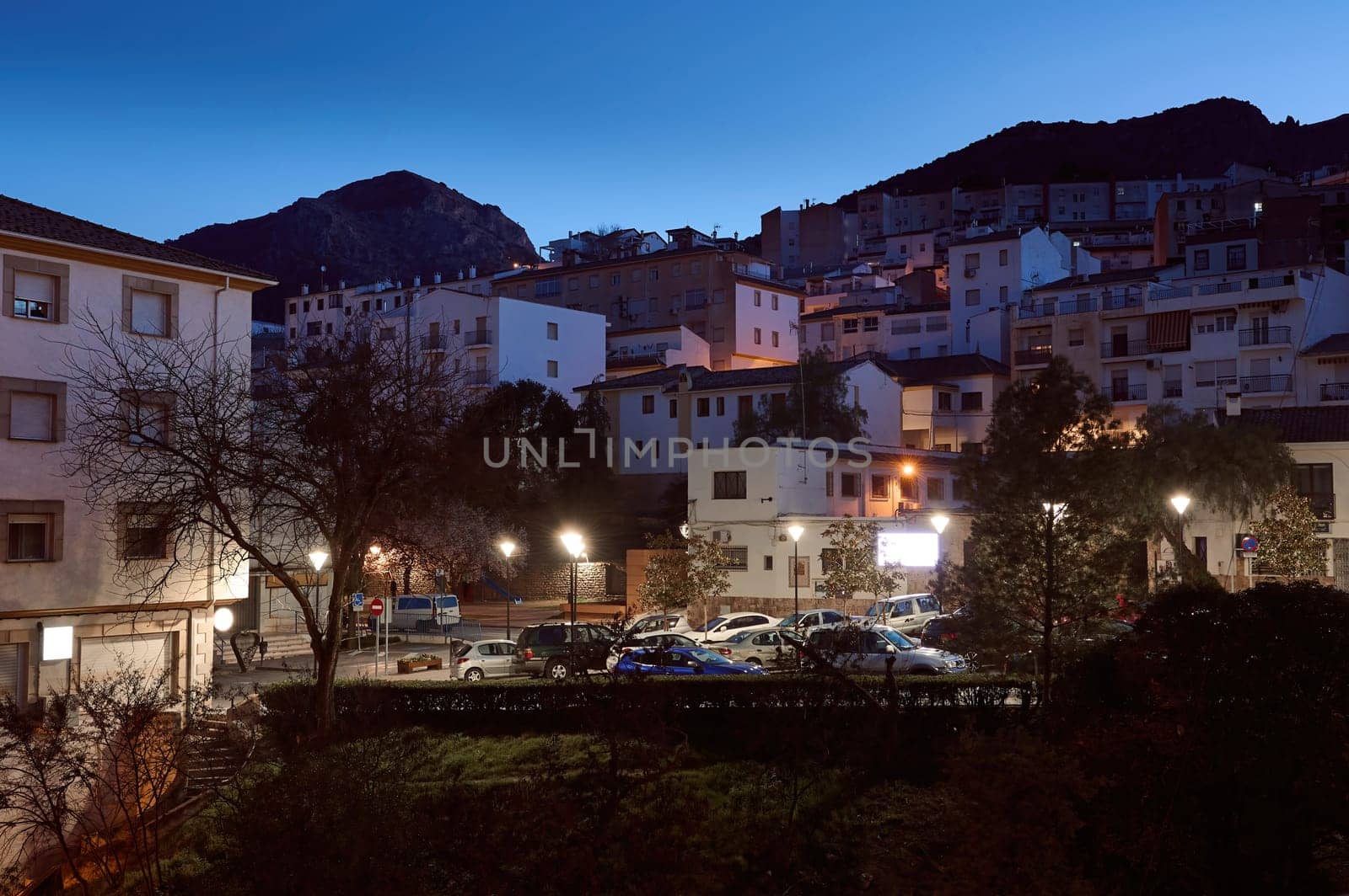 View of medieval Spanish city Quesada in province of Jaen in Andalusia, illuminated with street lights in the evening. Lifestyle, Travel and tourism concept. Discovering famous historic places. Spain
