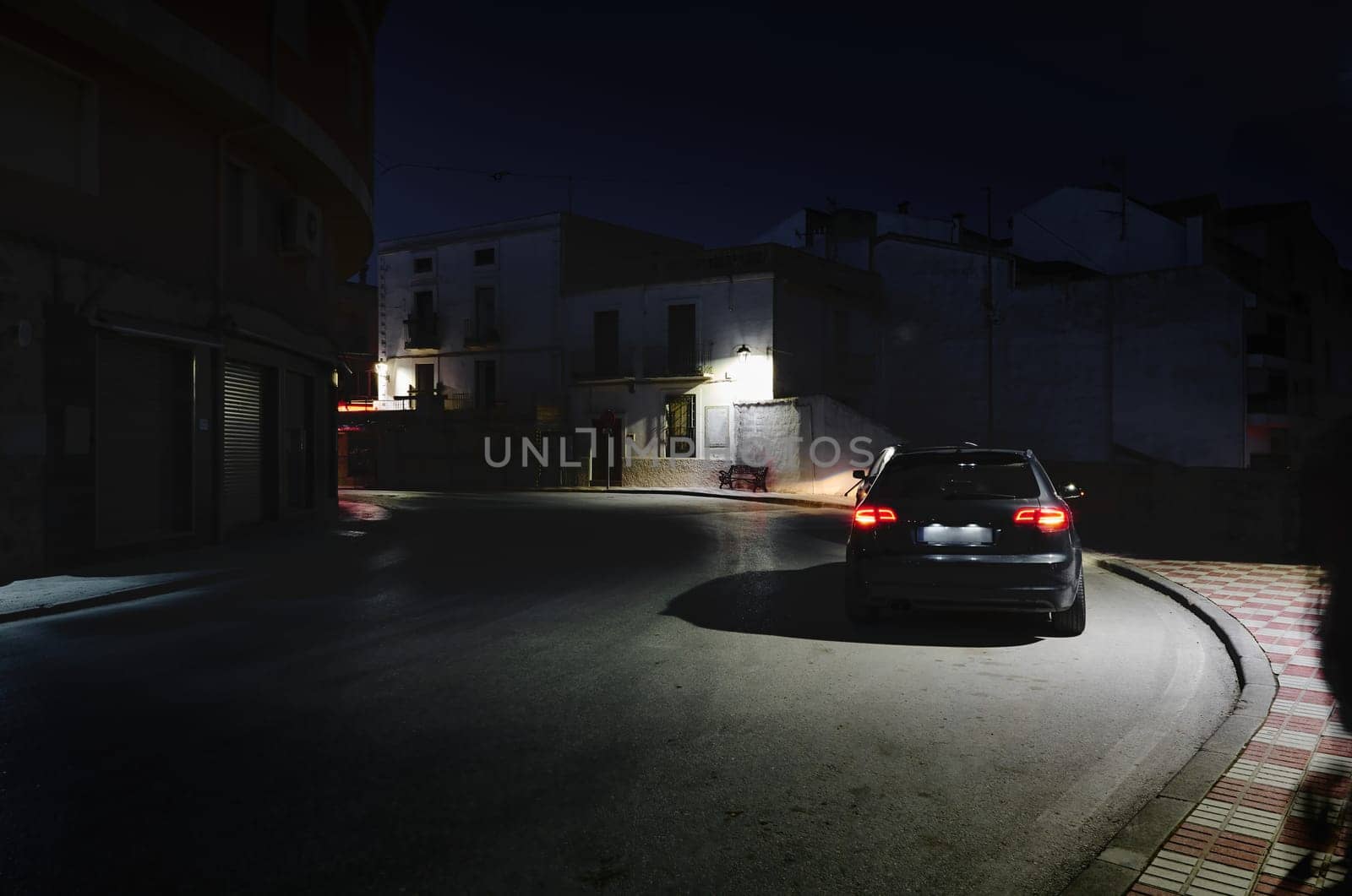A car on the road at night in the city of Quesada in the province of Jaen. Transportation. Travel and tourism concept