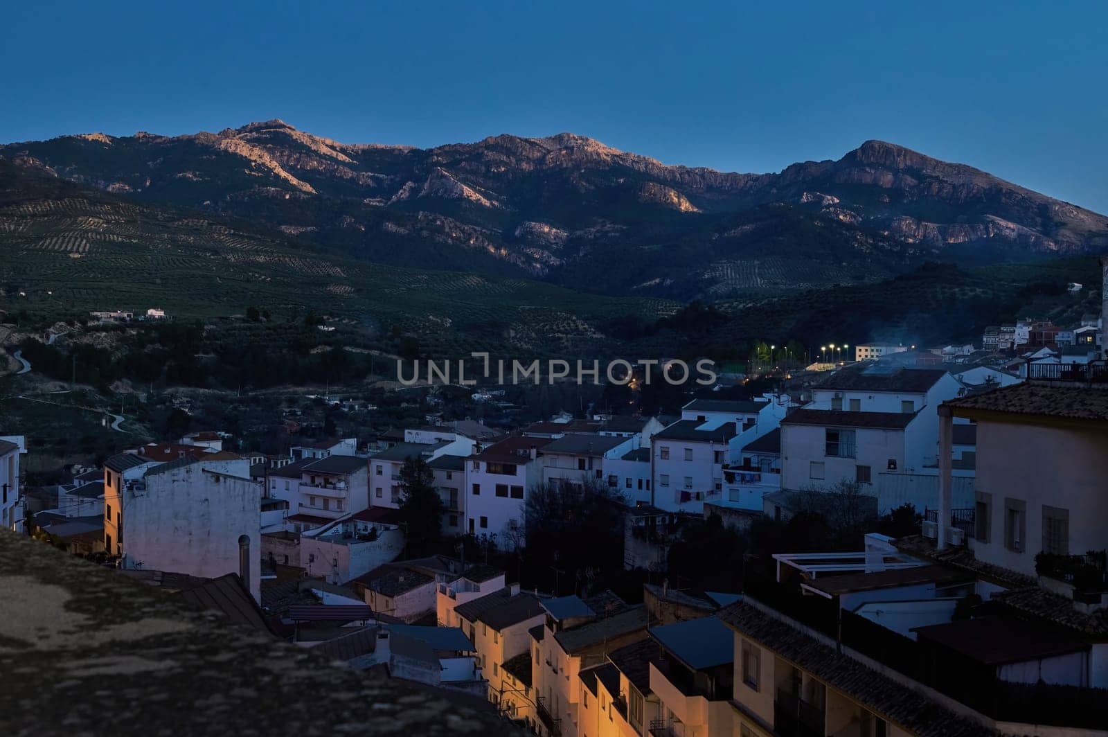 Sierra de Cazorla. Quesada, Jaen. Andalusia Spain. Beautiful mountains at evening and white buildings on the foreground. by artgf
