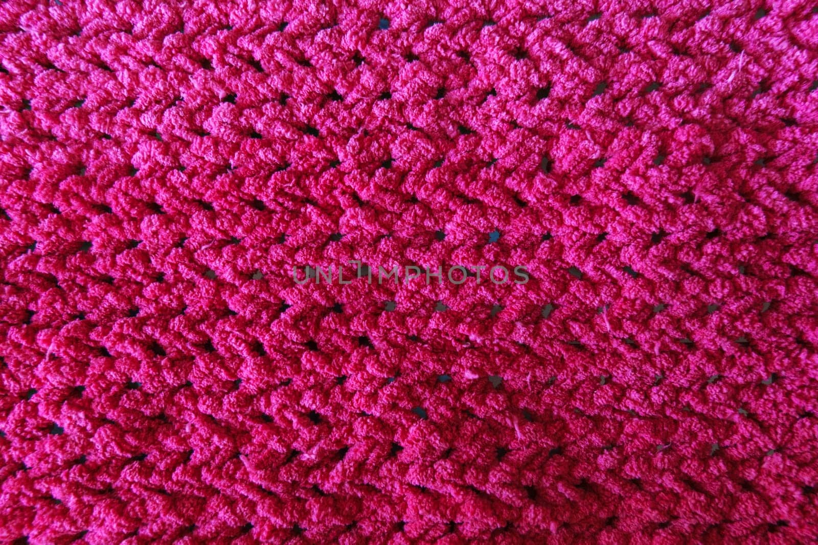 Textures of this close-up of a pink crocheted blanket. by darksoul72