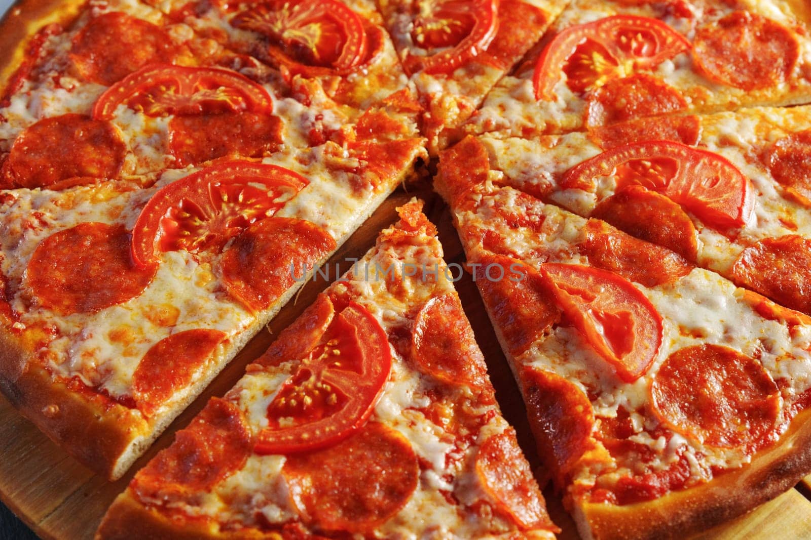 Delectable Pepperoni and Tomato Pizza on Wooden Board