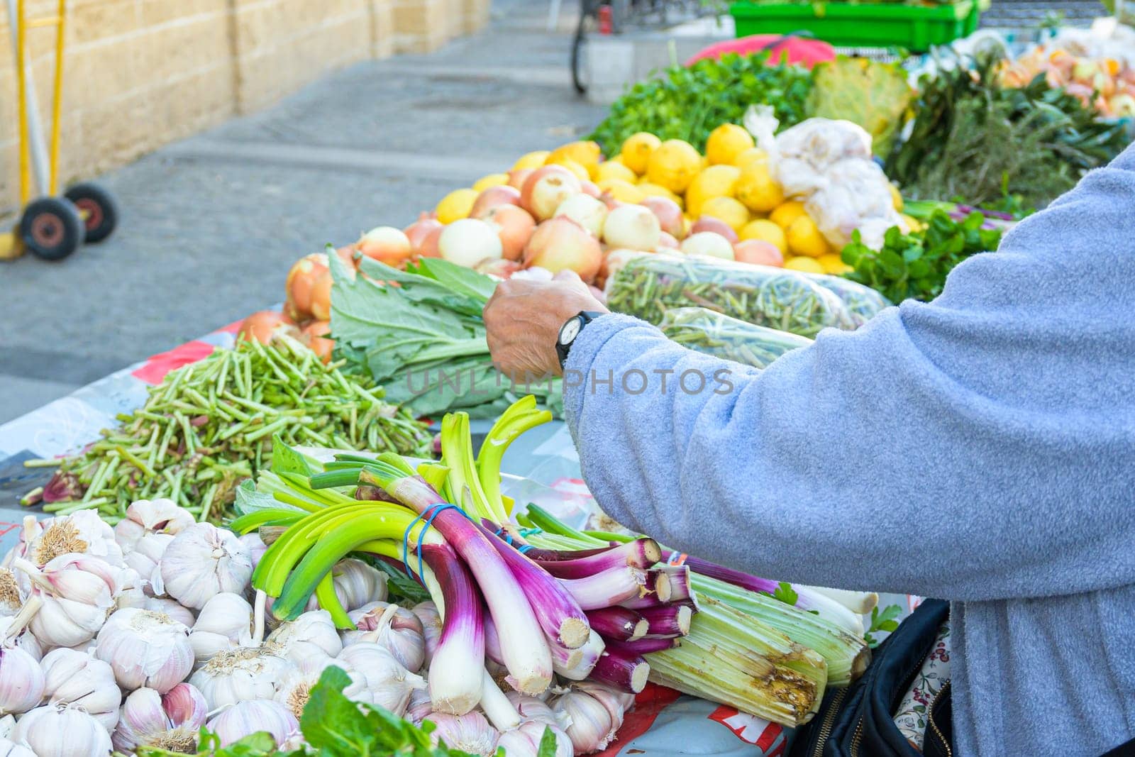 American business woman chooses and buys fresh fruits in supermarket for restaurant by jcdiazhidalgo