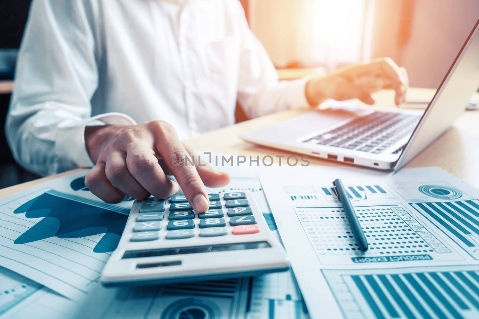 Businessman accountant or financial expert analyze business report graph and finance chart at corporate office. Concept of finance economy, banking business and stock market research. uds