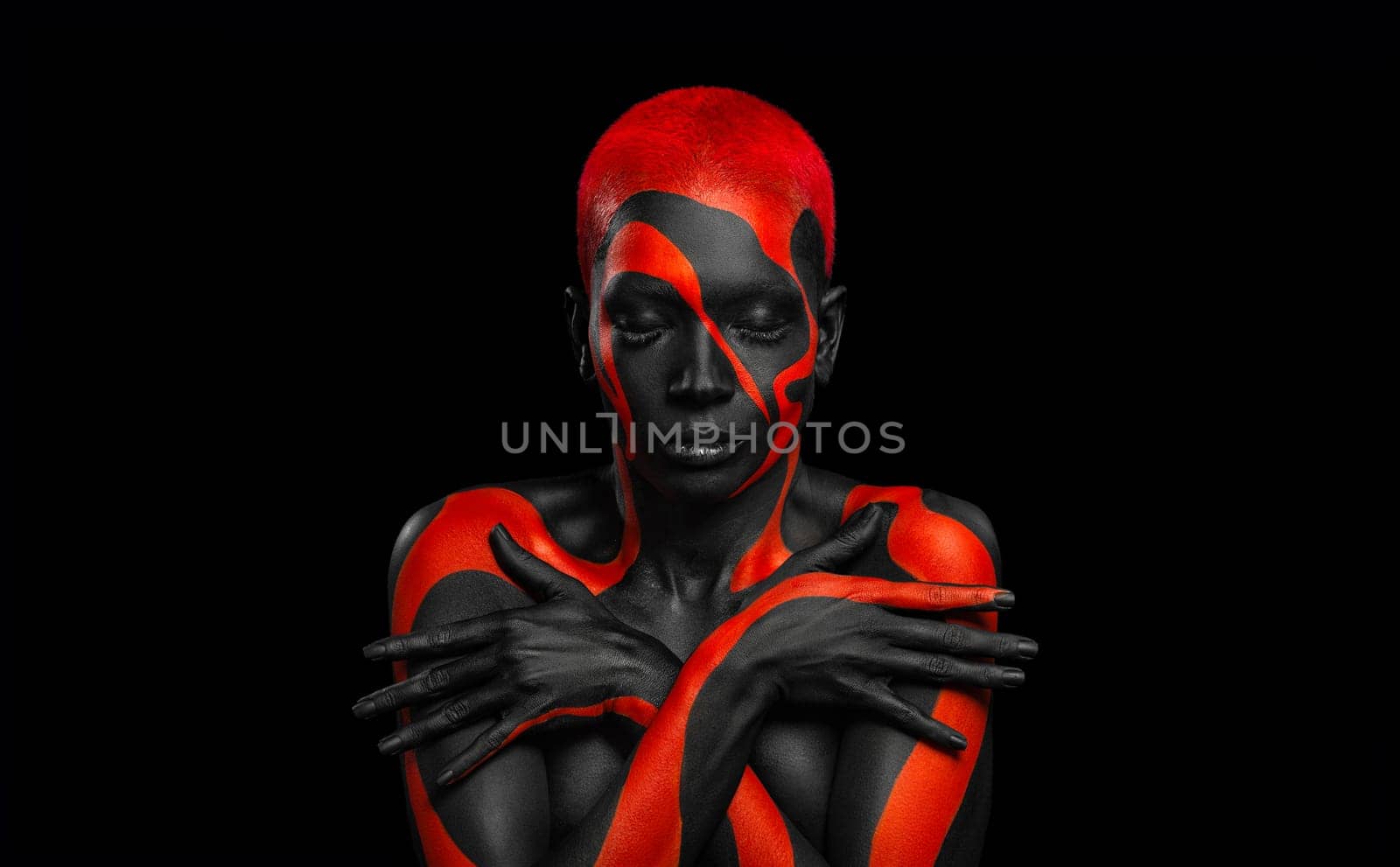 The Art Face. Black and yellow body paint on african woman. Abstract creative portrait. Copy space for your text.