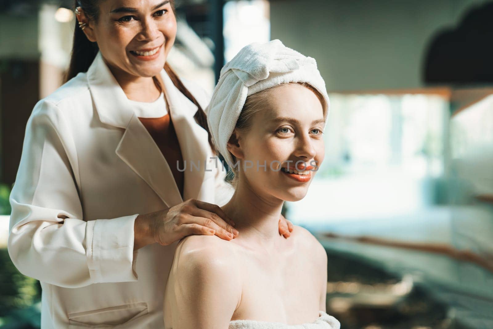 Attractive caucasian woman having back massage at spa salon. Tranquility. by biancoblue