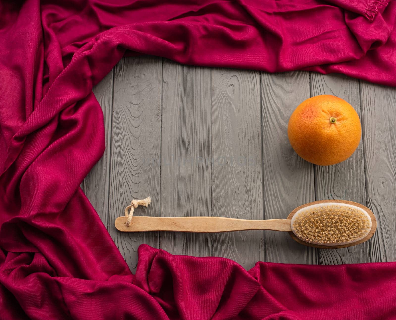 skin preparation body beach anti-cellulite massage cactus brush big orange peel. Summer background template mockup free space pattern composition sample text. Top view above grey wooden background