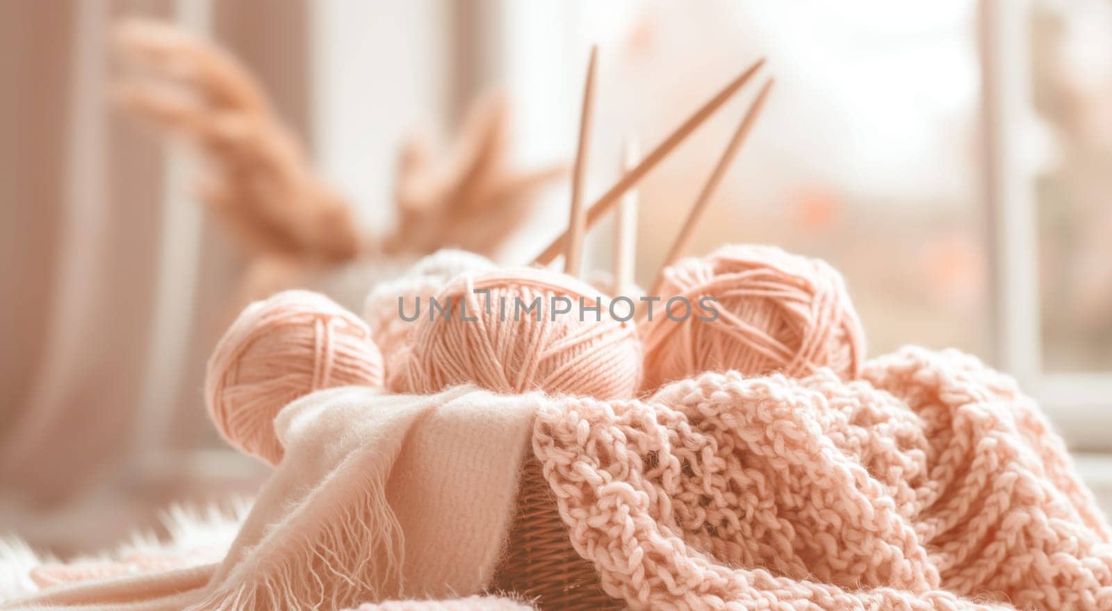 Knitting needles and yarn balls in basket with soft focus. High quality photo