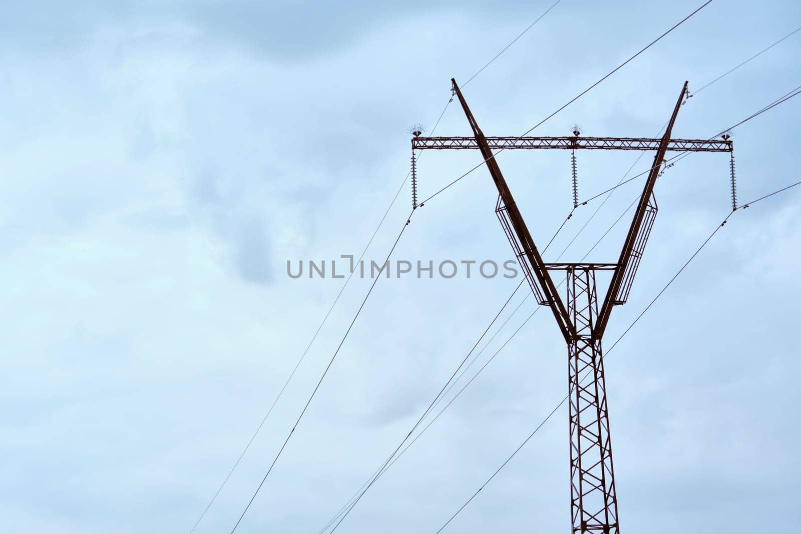 line of power lines against the blue sky color by lempro