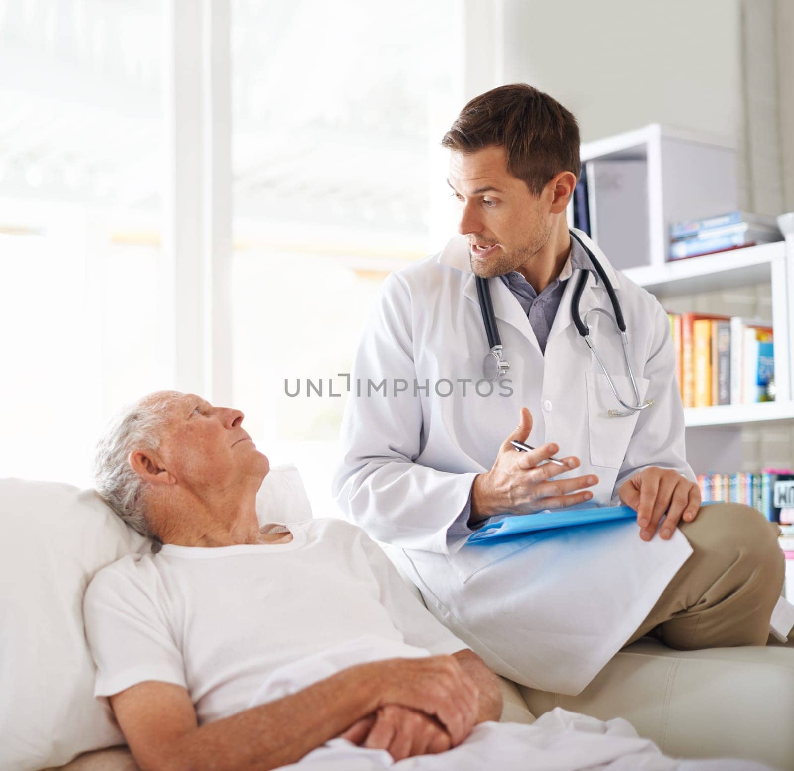 Doctor, communication and elderly man on sofa with discussion, consultation or advice for treatment in hospice. Healthcare, patient and medical professional with talking for planning, help or results by YuriArcurs