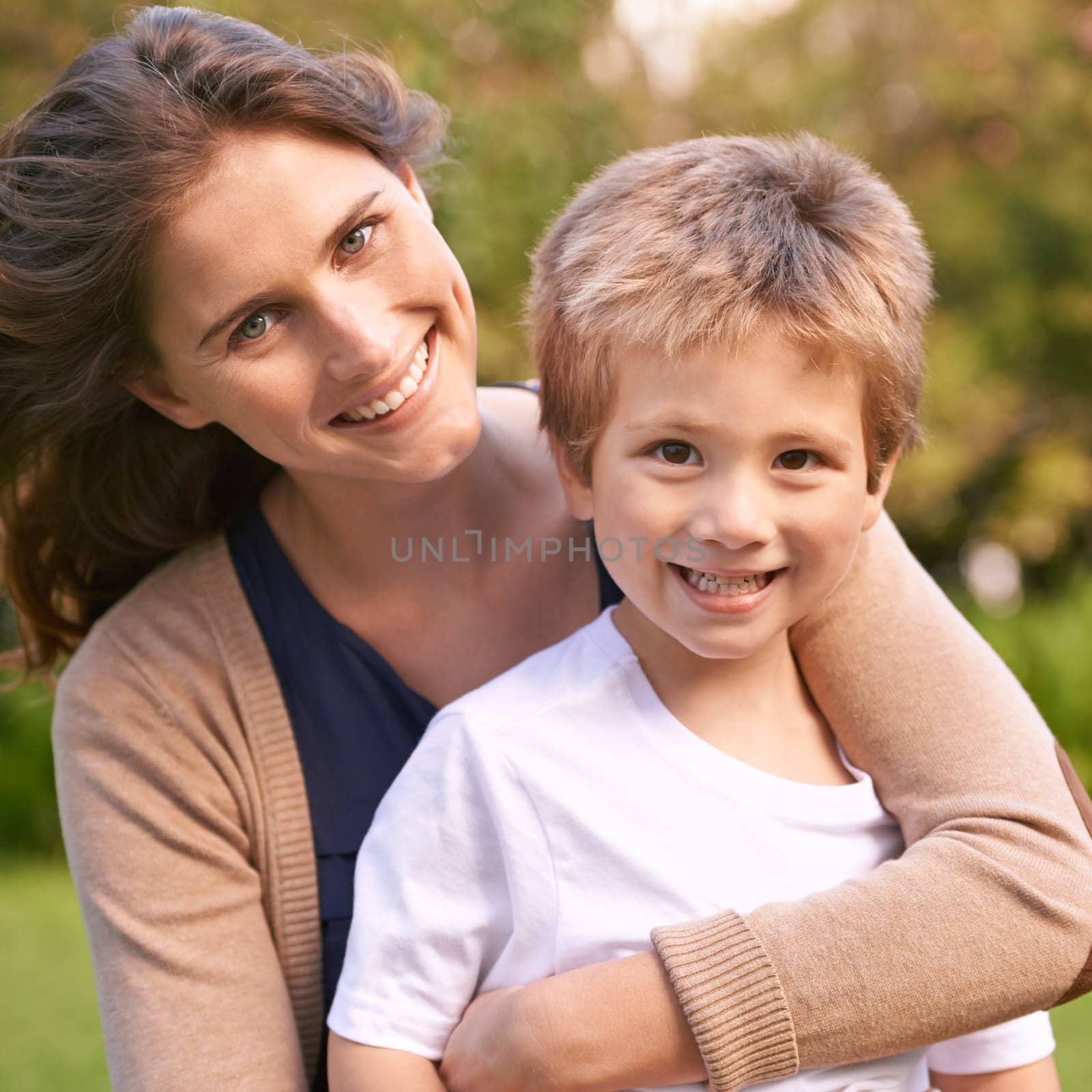 Mother, son and hug with park, love and smile with portrait and together for happiness. Woman, child and nature with embrace, bonding and family with care and childhood for parenting in backyard.
