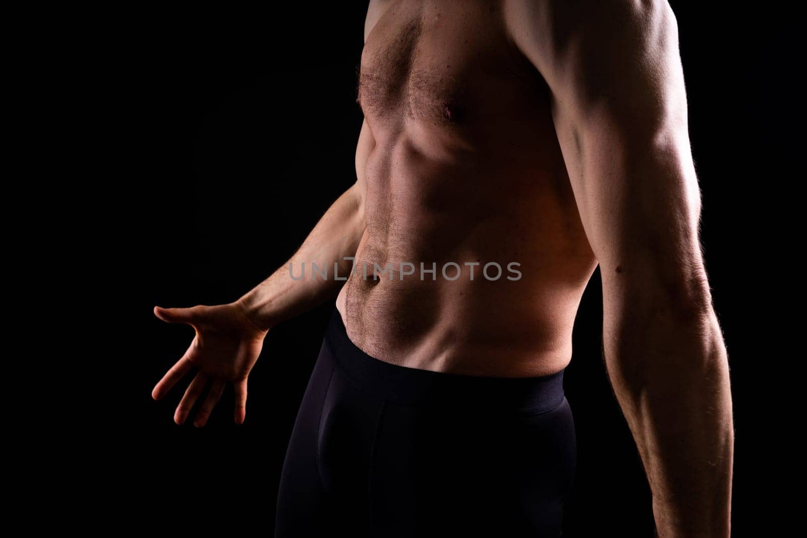 Image of muscle man posing in studio, dark white red background by Zelenin