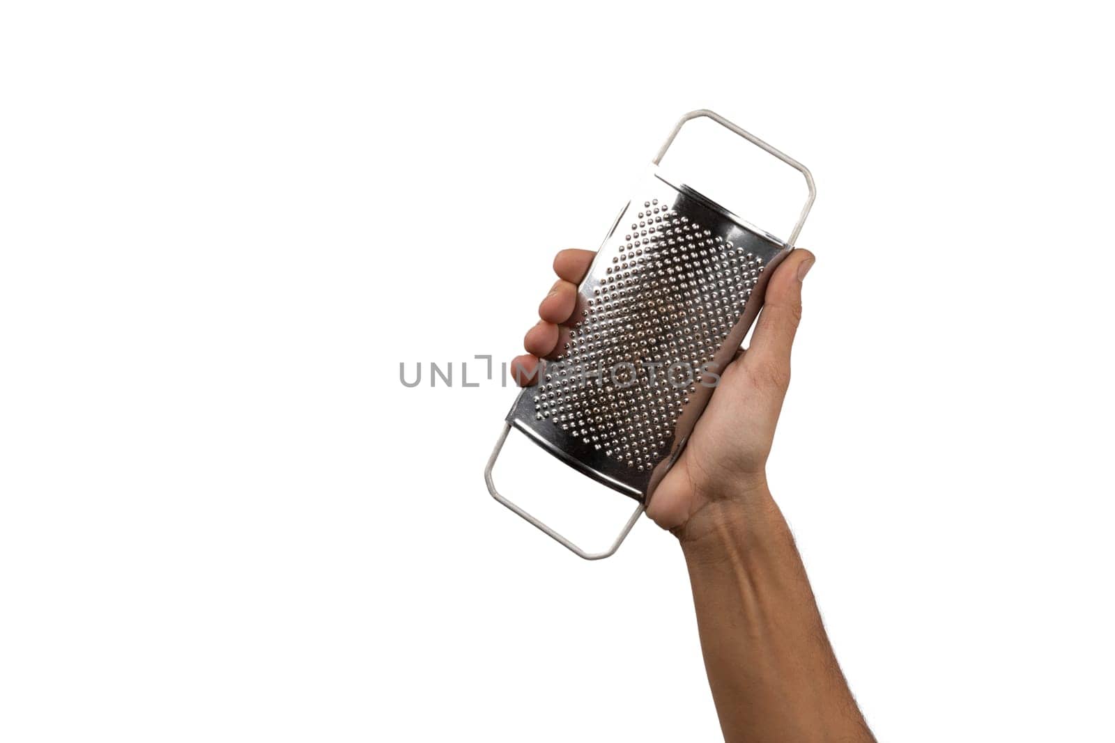 Male hand holding kitchen grater isolated white background. High quality photo