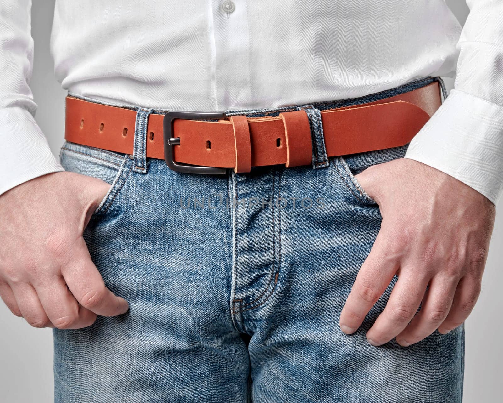 Casual male look completed with handmade brown genuine leather belt featuring embossed DAD customization, merging personal style with artisan quality