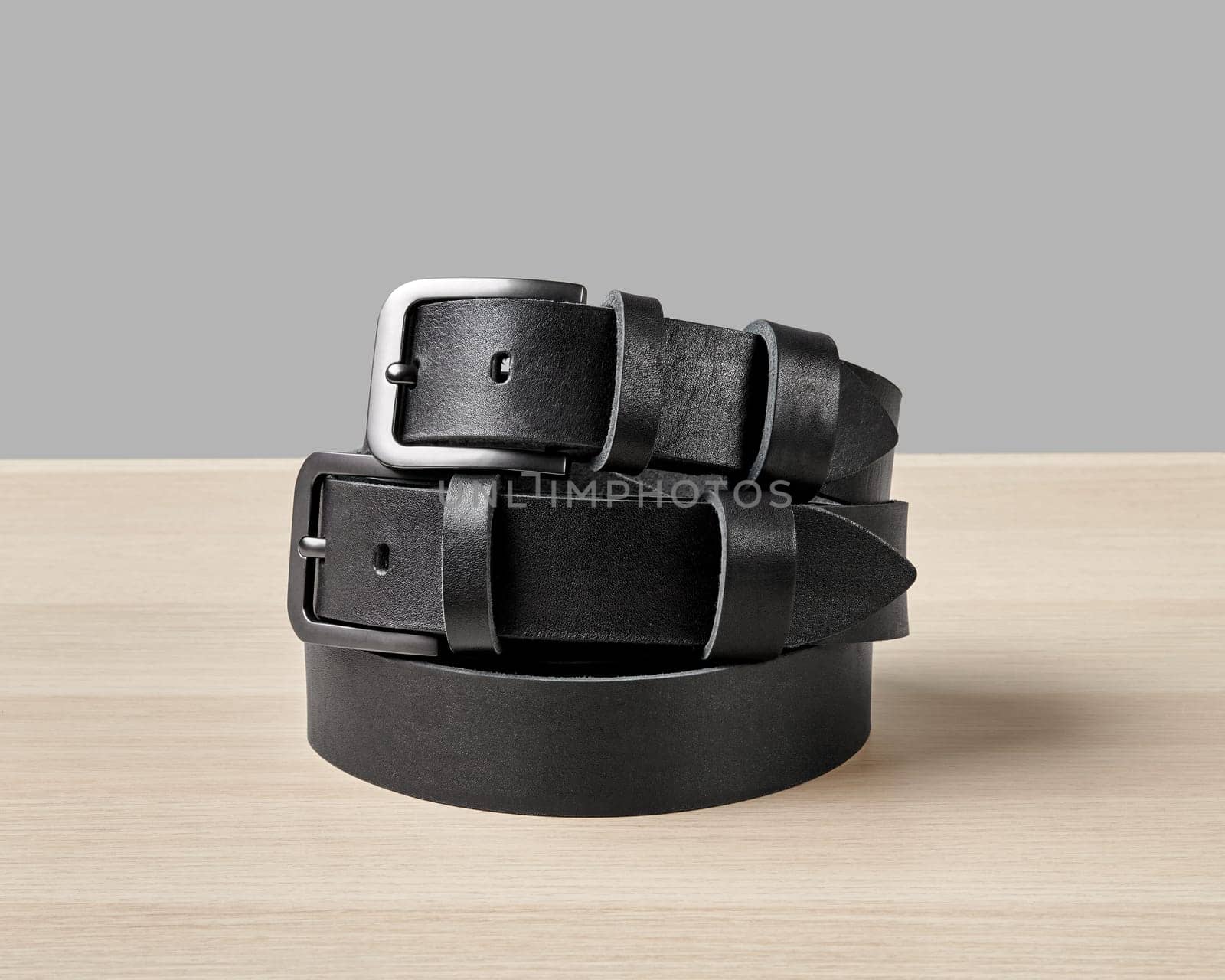 Two folded black leather belts with bespoke DAD embossing by nazarovsergey