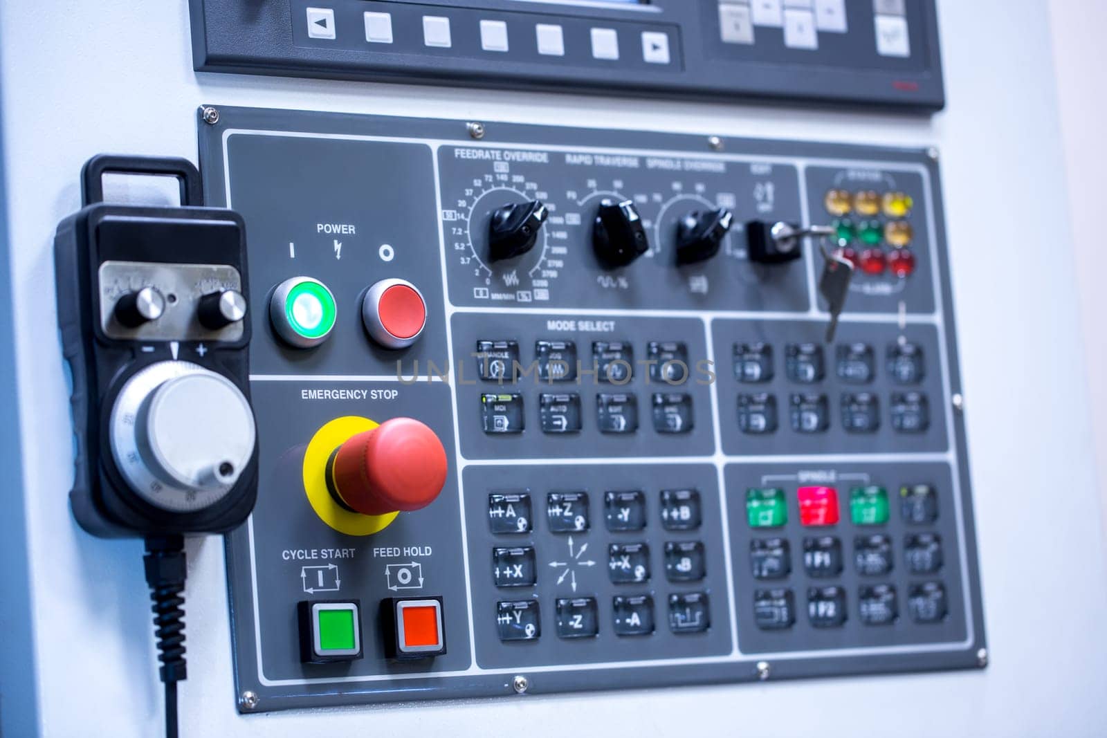 Switches on control panel of production machine, close-up