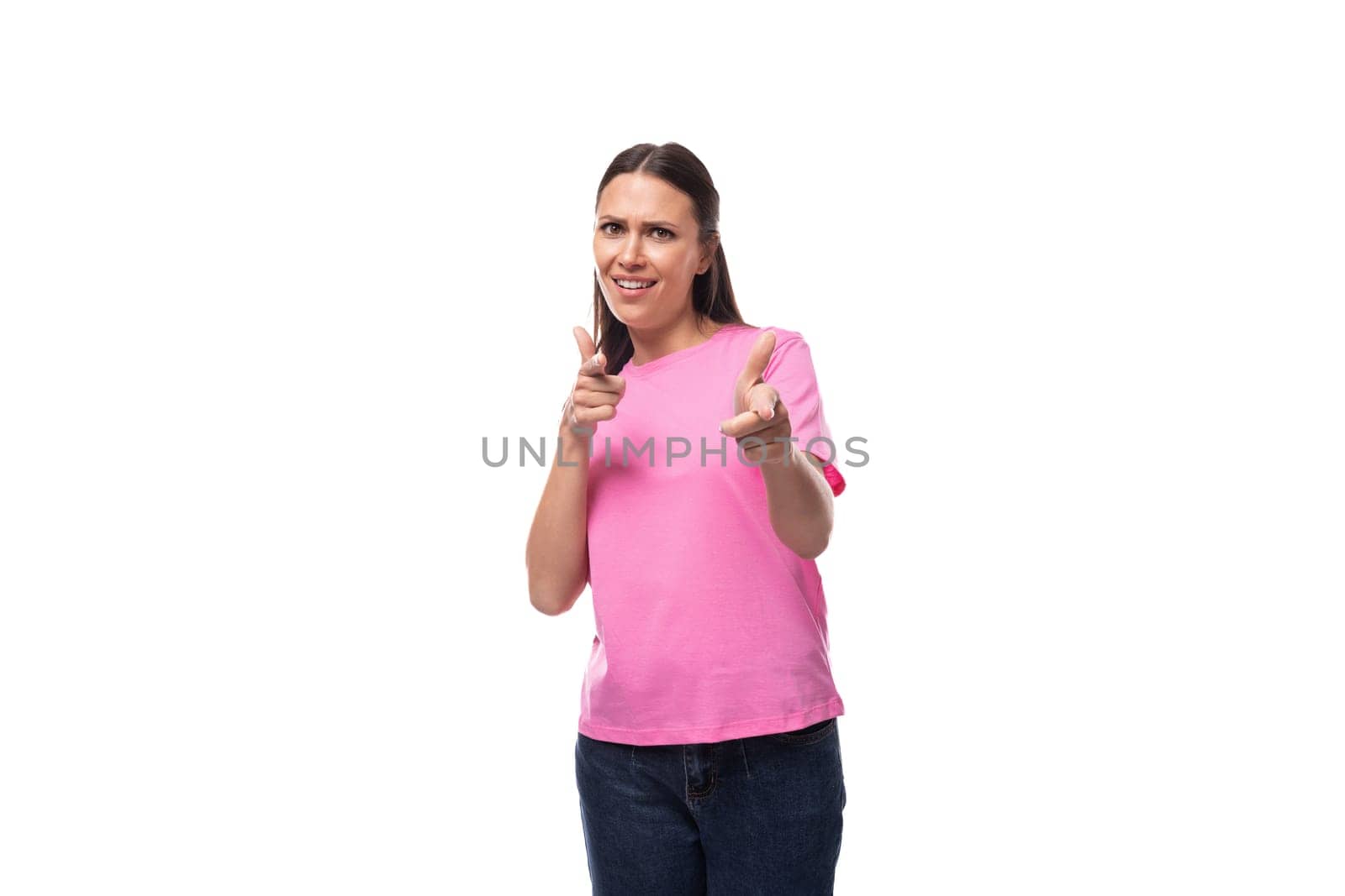 young stylish brunette lady dressed in a pink t-shirt feels optimistic.