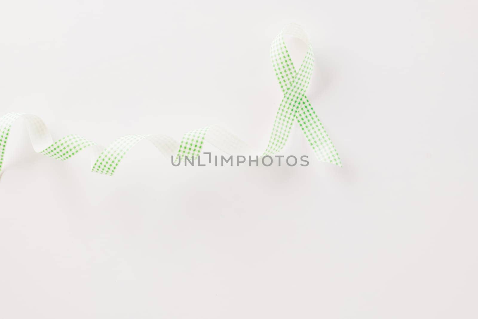 Green awareness ribbon of Gallbladder and Bile Duct Cancer month by Sorapop