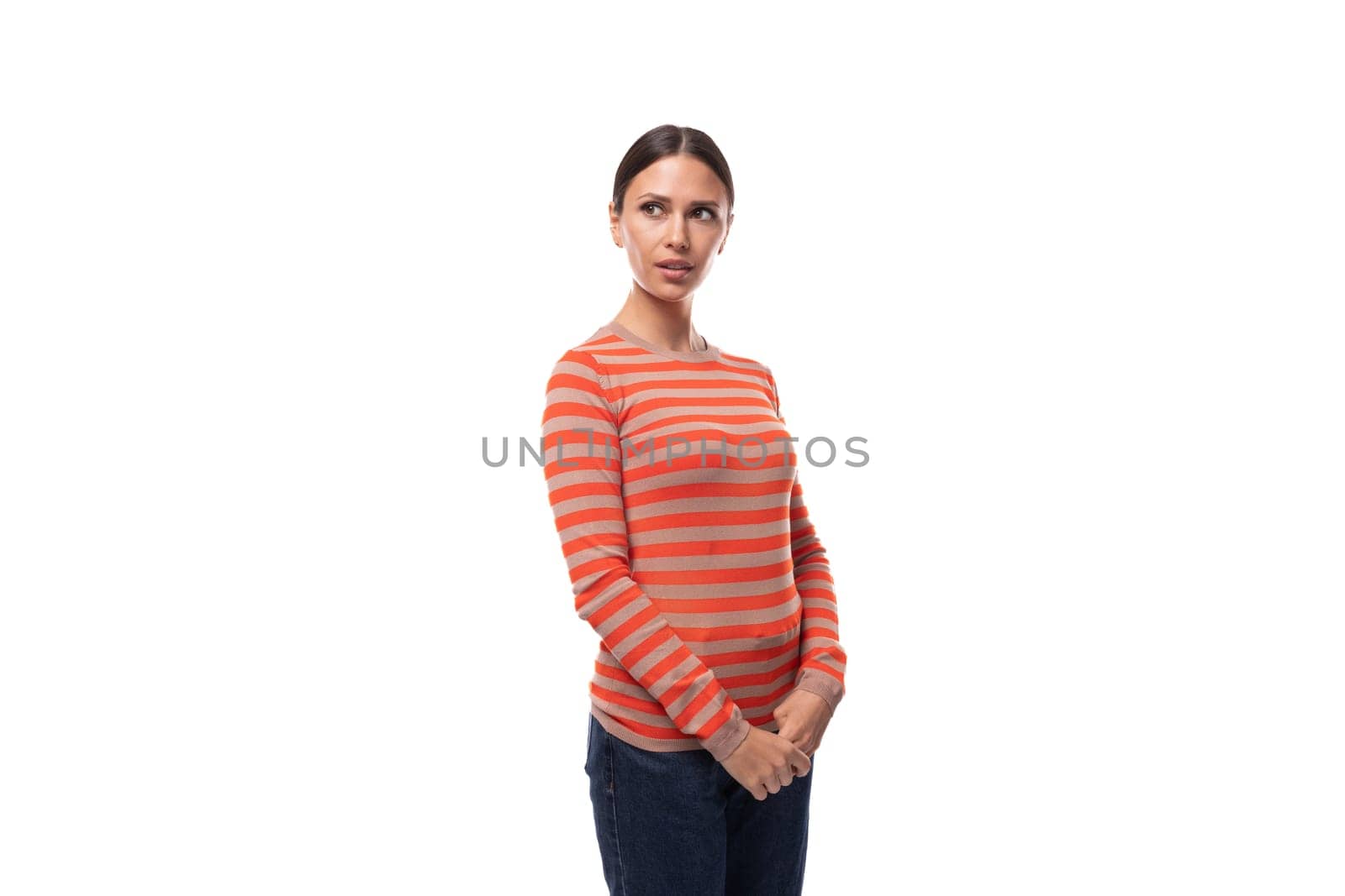 young pretty brunette lady dressed in a casual striped blouse points her finger to the side by TRMK