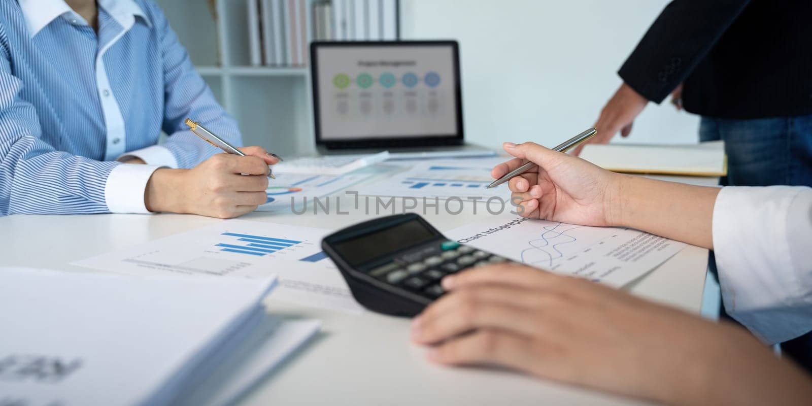 Business team analyzing income chart and graph in office. Close up. Business analysis and strategy concept.