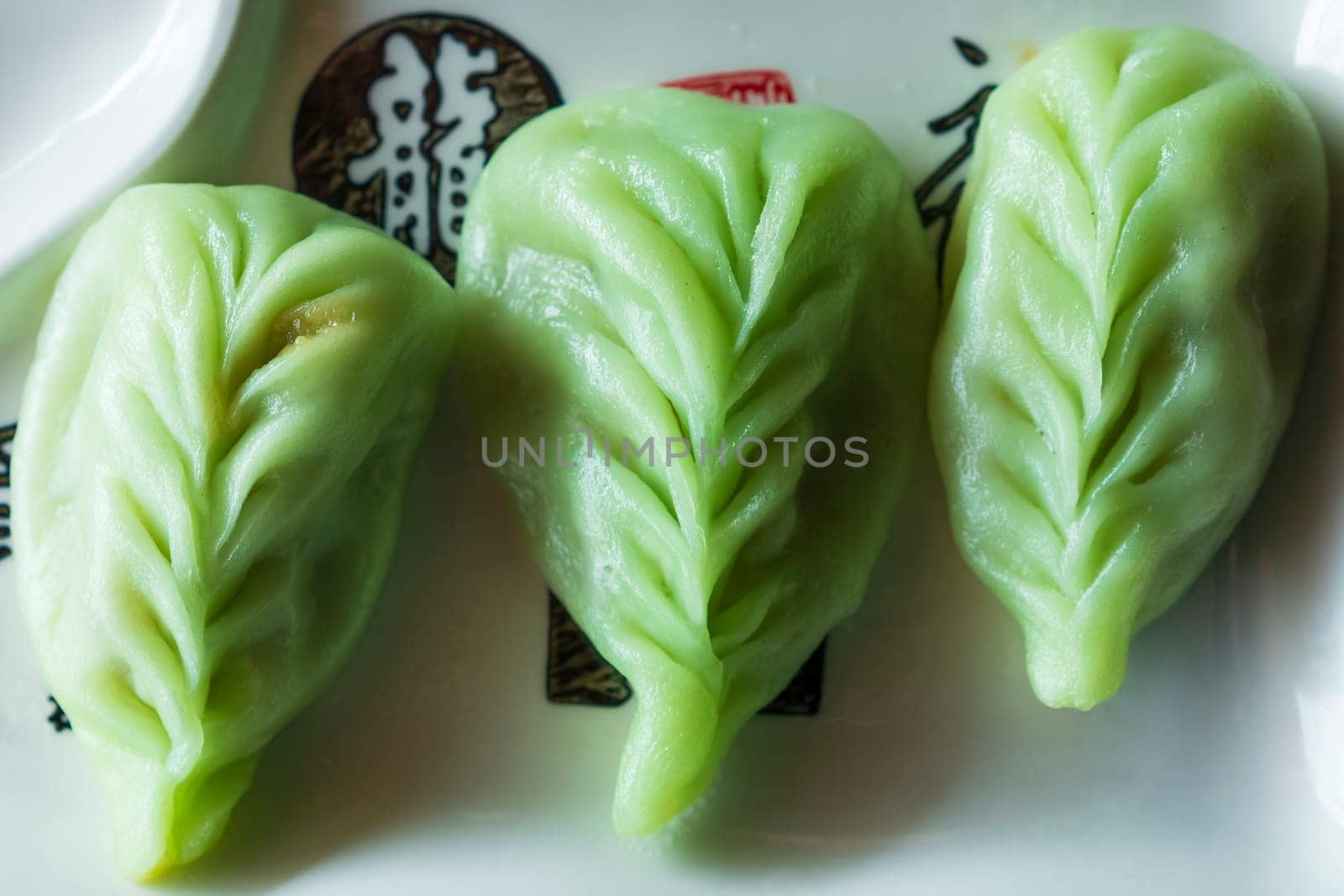 Top view of green japanese dumplings Gyoza with vegetables close up by Robertobinetti70