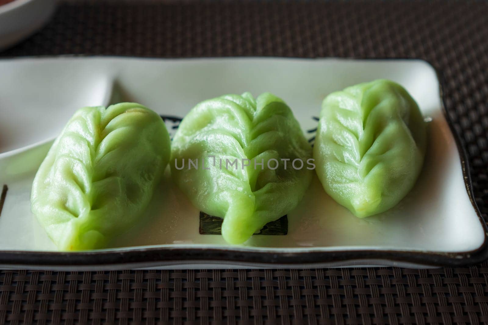 green japanese dumplings Gyoza with vegetables at restaurant by Robertobinetti70