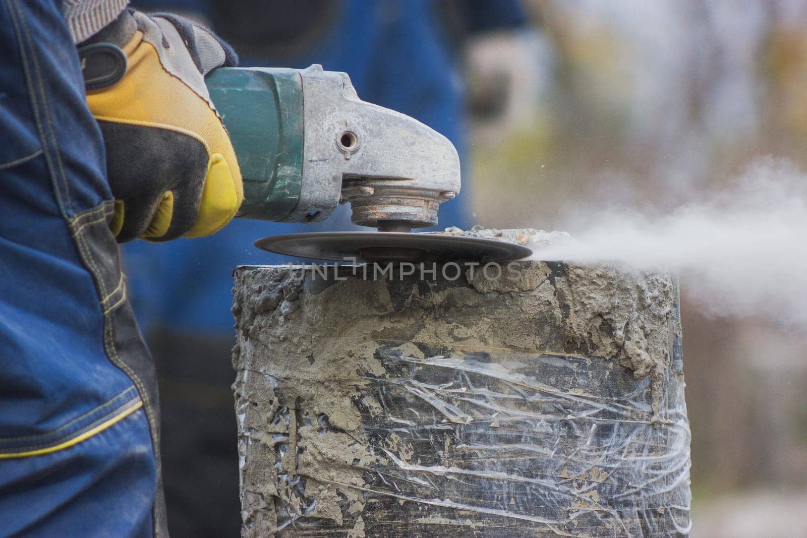 Working circular saw outdoors, sawdust flying around by Studia72