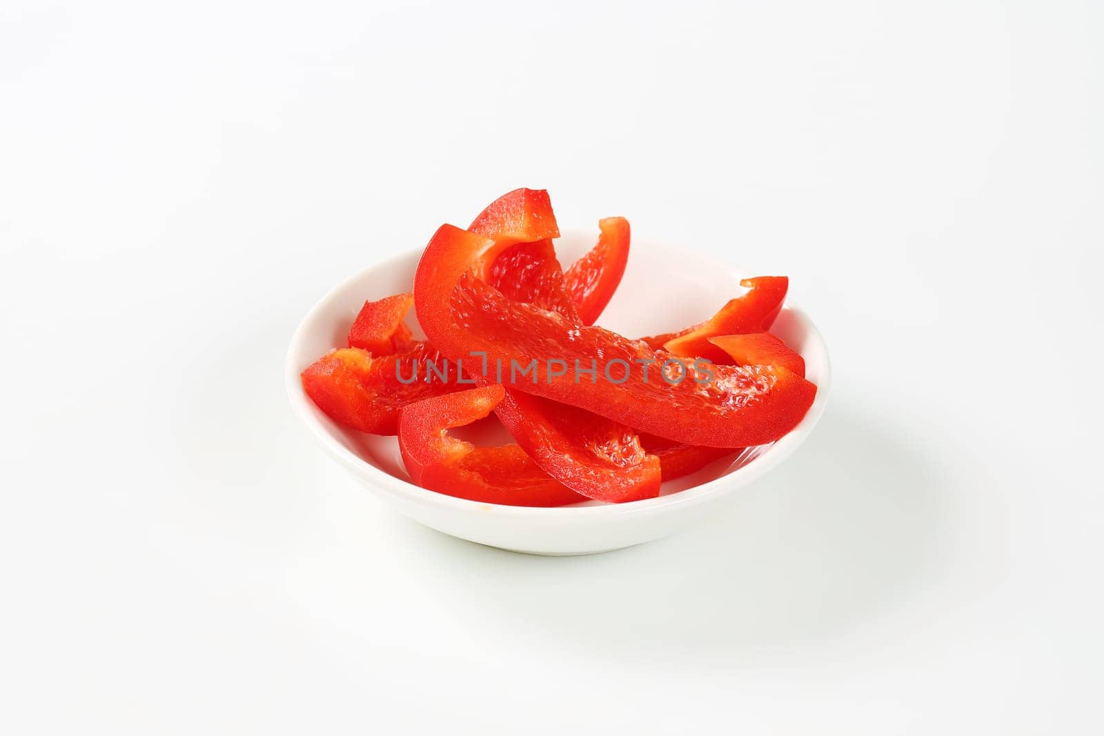 Slices of red bell pepper by Digifoodstock