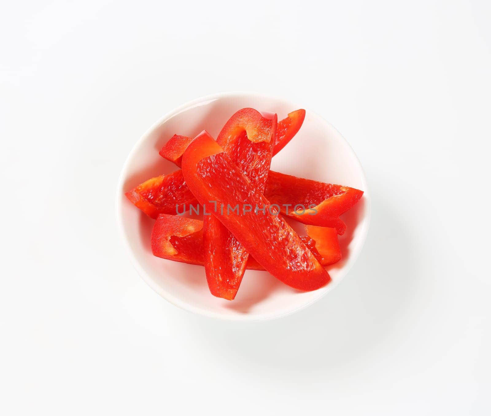 Slices of red bell pepper by Digifoodstock