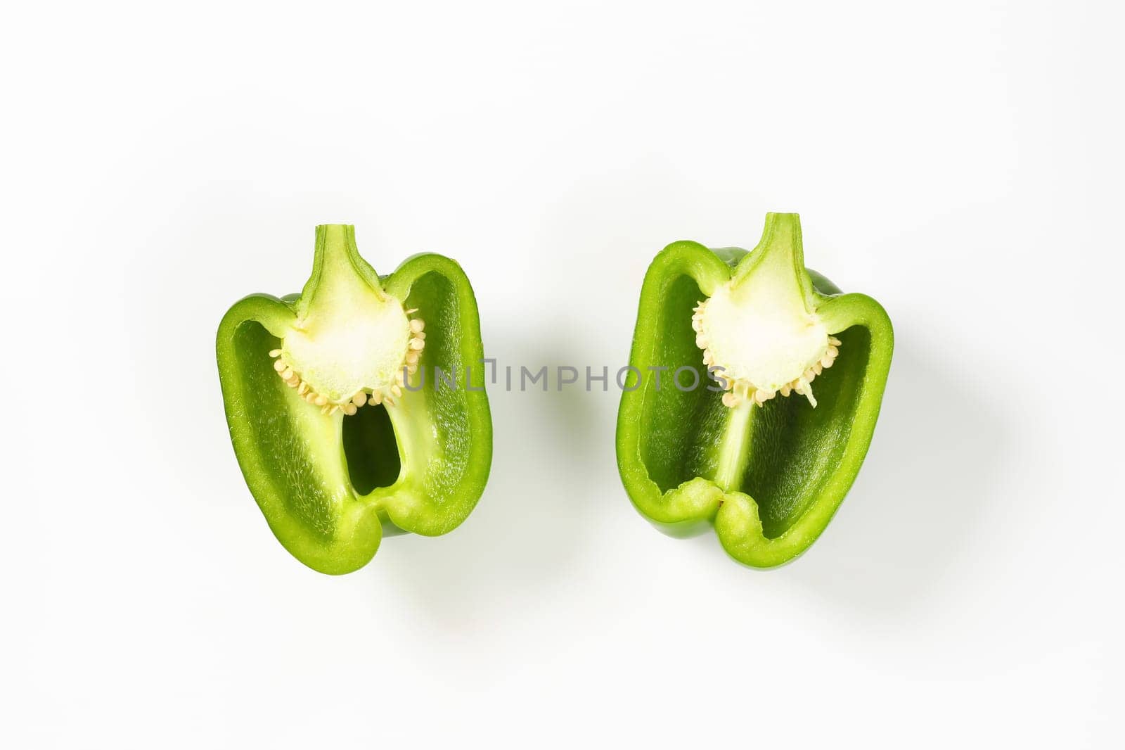 Fresh green bell pepper cut into halves