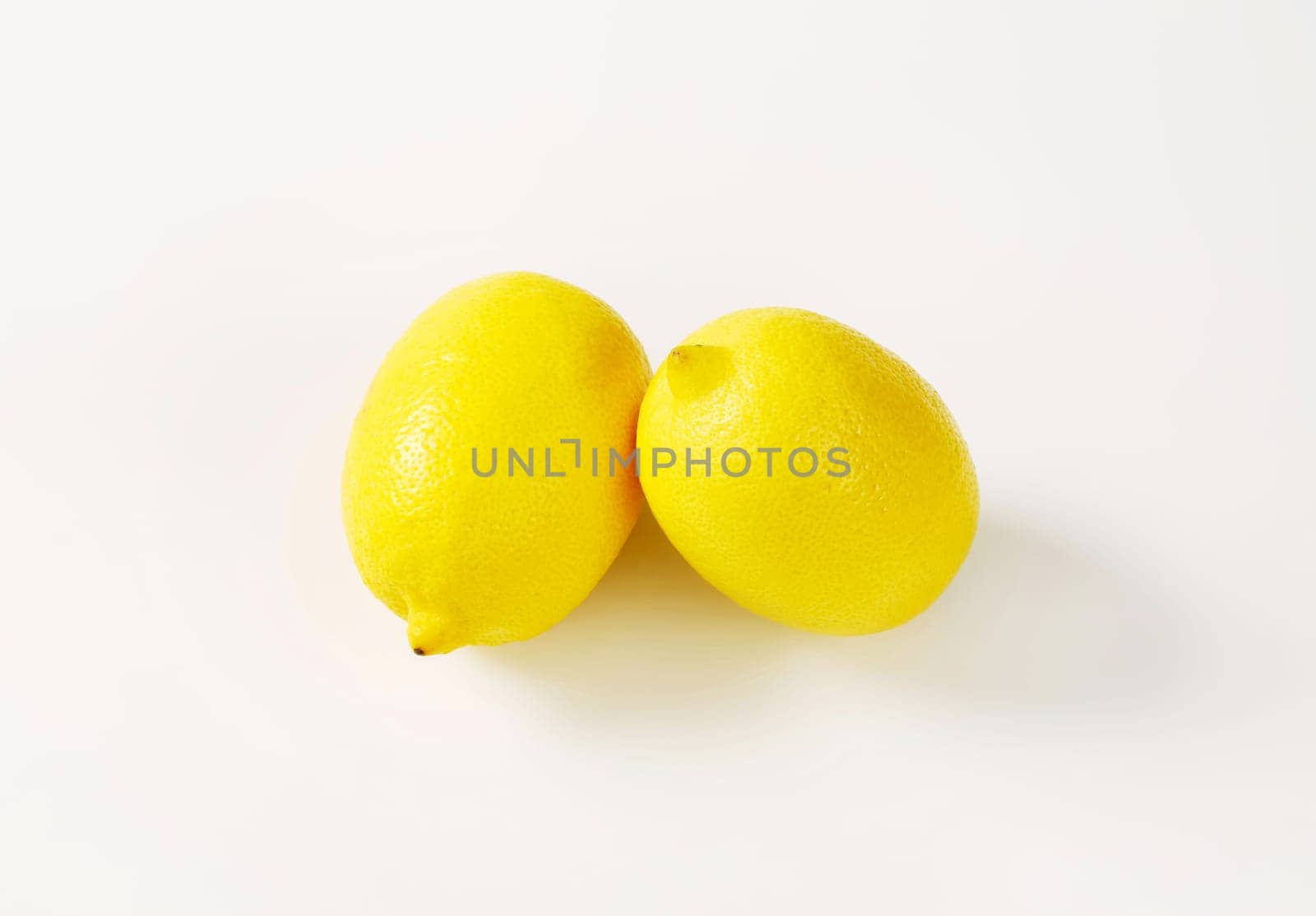 Two fresh lemons by Digifoodstock