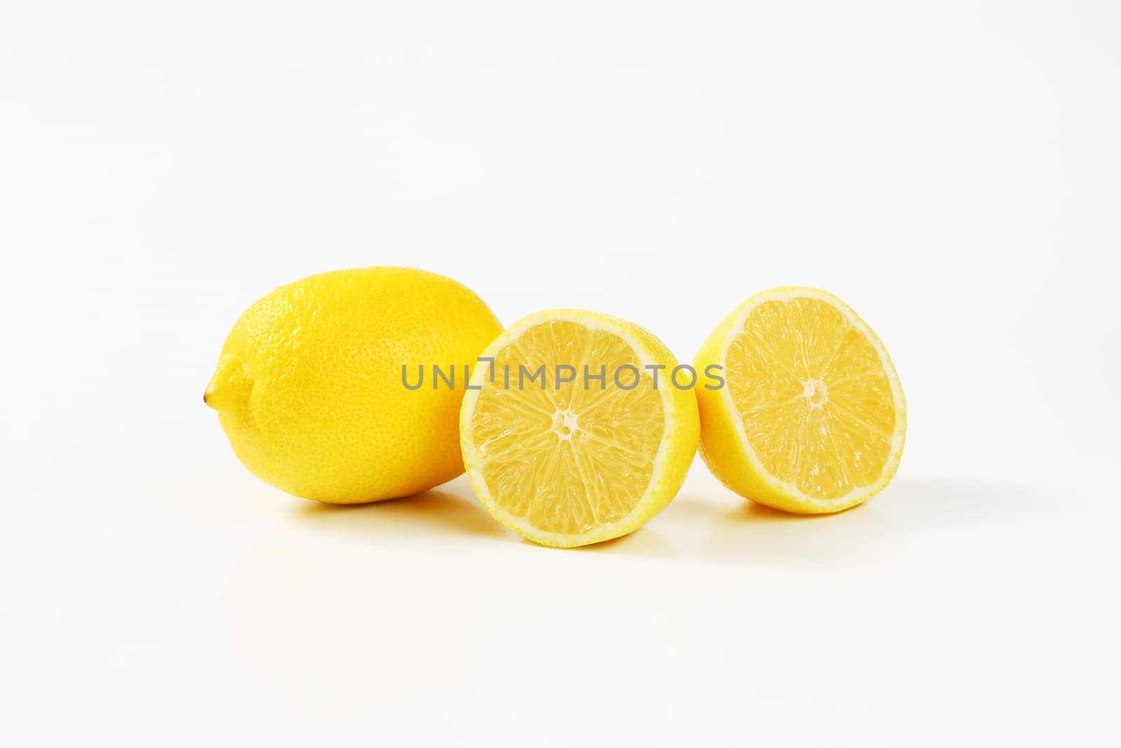 Fresh lemons - one whole and two halves