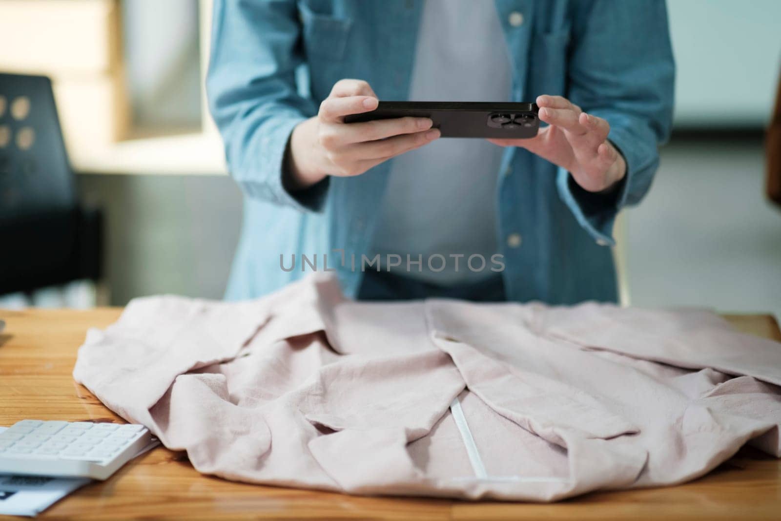 Online Business Owner Photographing Apparel for SaleOnline Business Owner Photographing Apparel for Sale. by ijeab