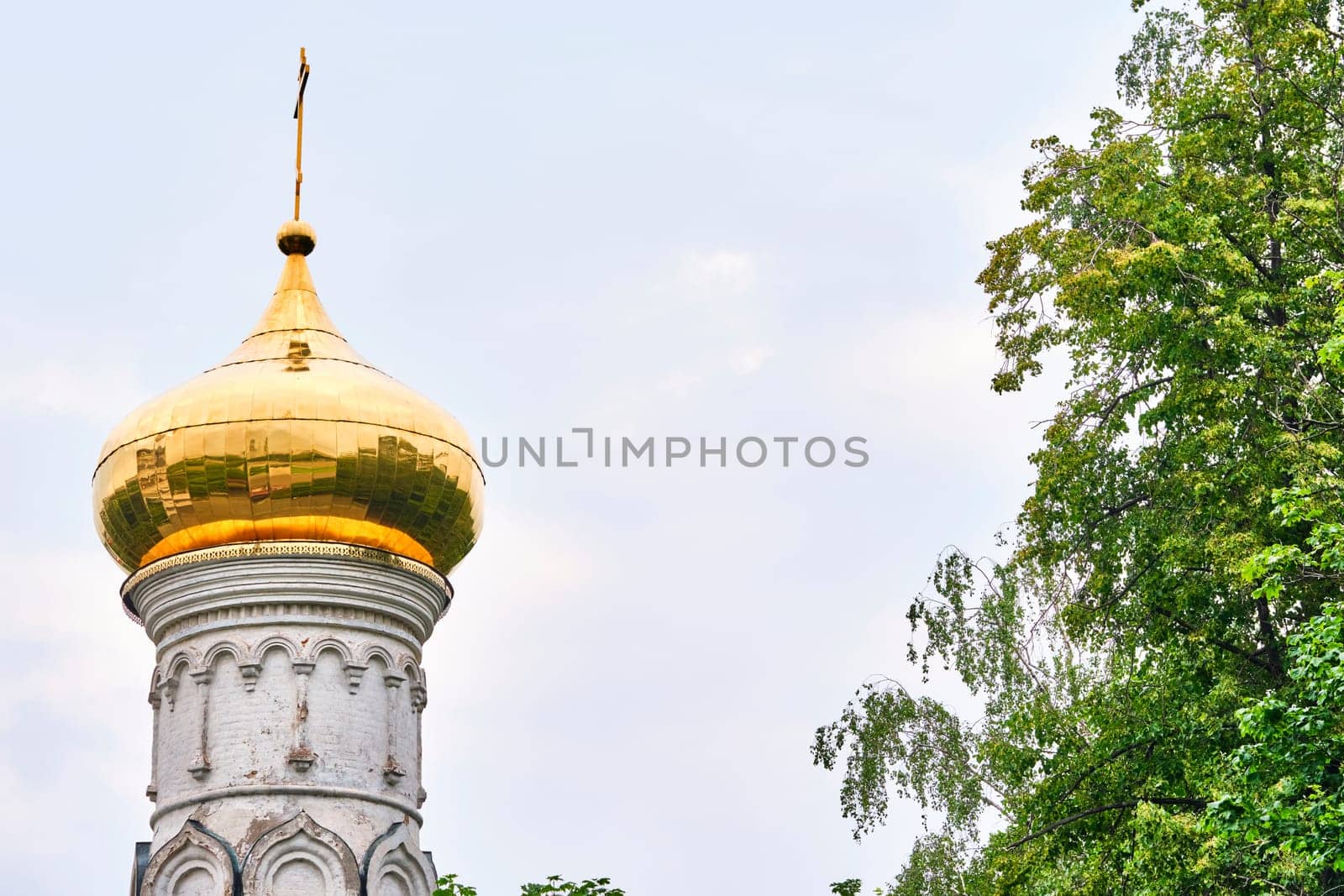 Russia-2020. Church domes of the Orthodox Church behind the trees. general plan. daylight