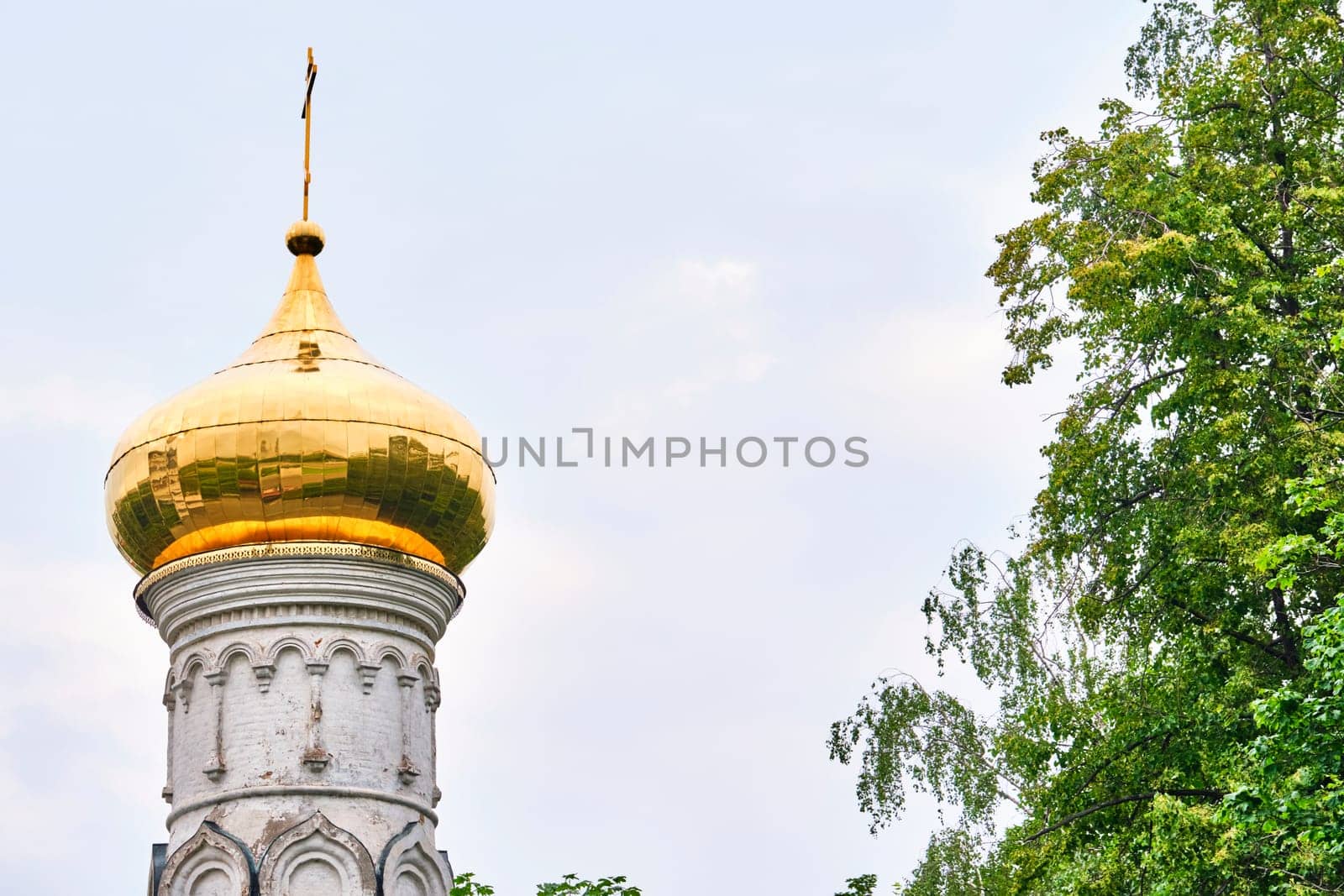 Russia-2020. Church domes of the Orthodox Church behind the trees. general plan. daylight