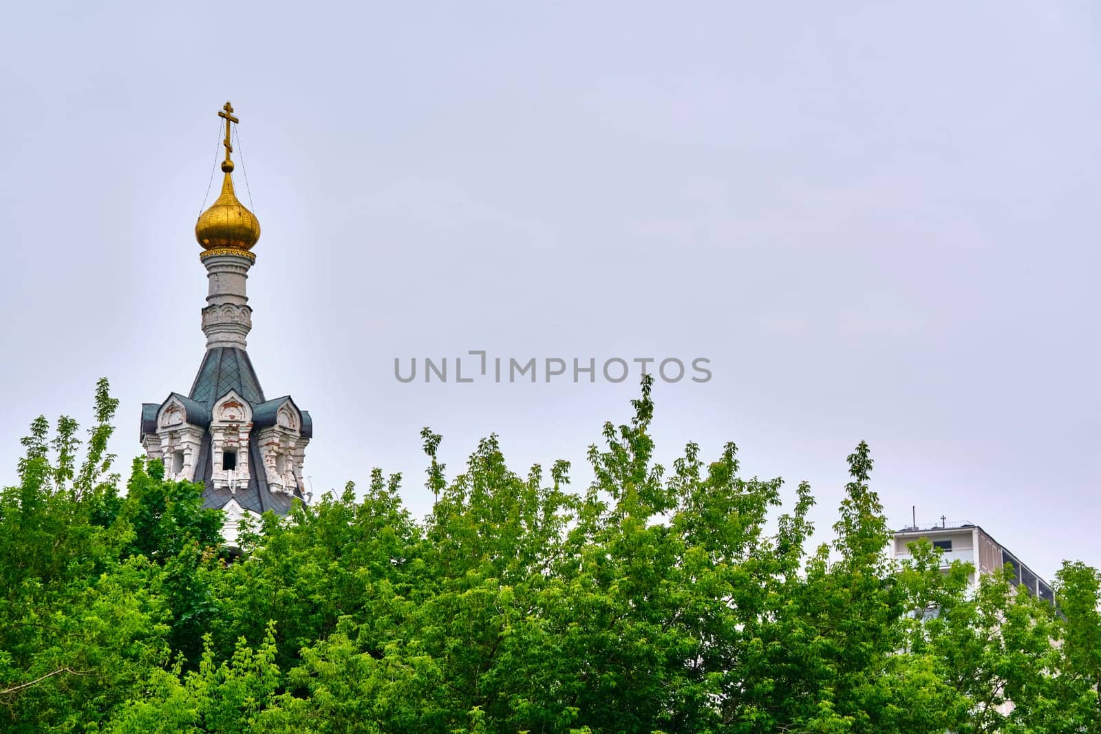 Russia-2020. Church domes of the Orthodox Church behind the trees. general plan. daylight