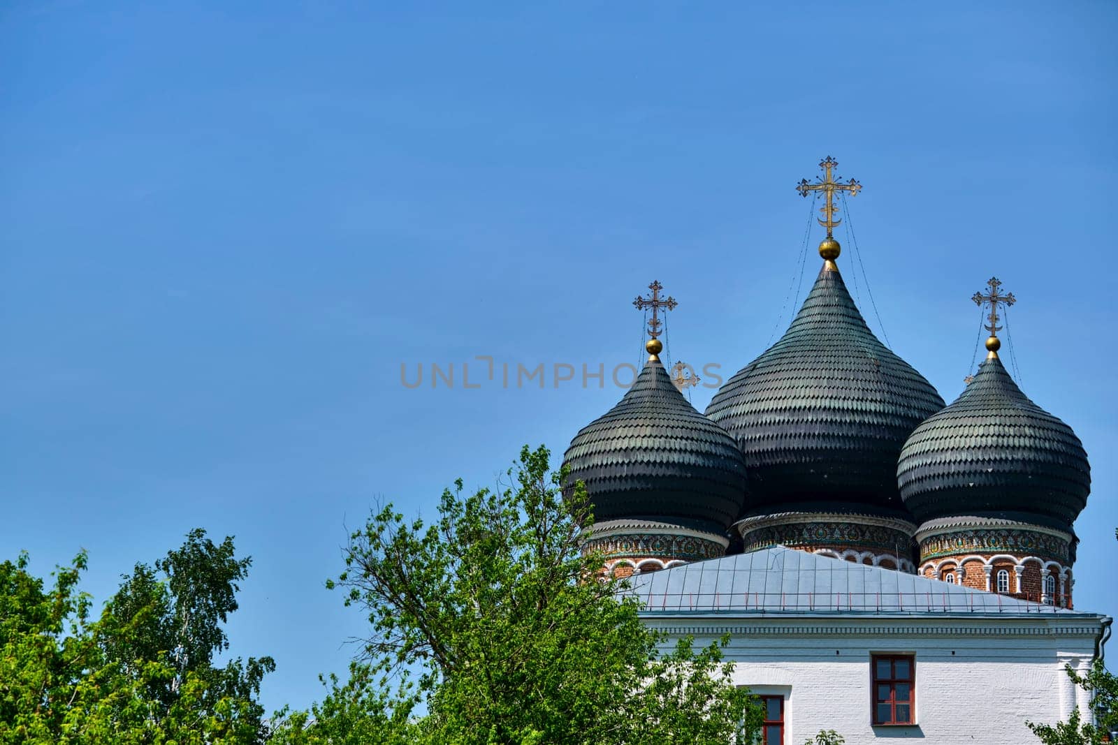 Russia-2020. Church domes of the Orthodox Church behind the trees. general plan. daylight