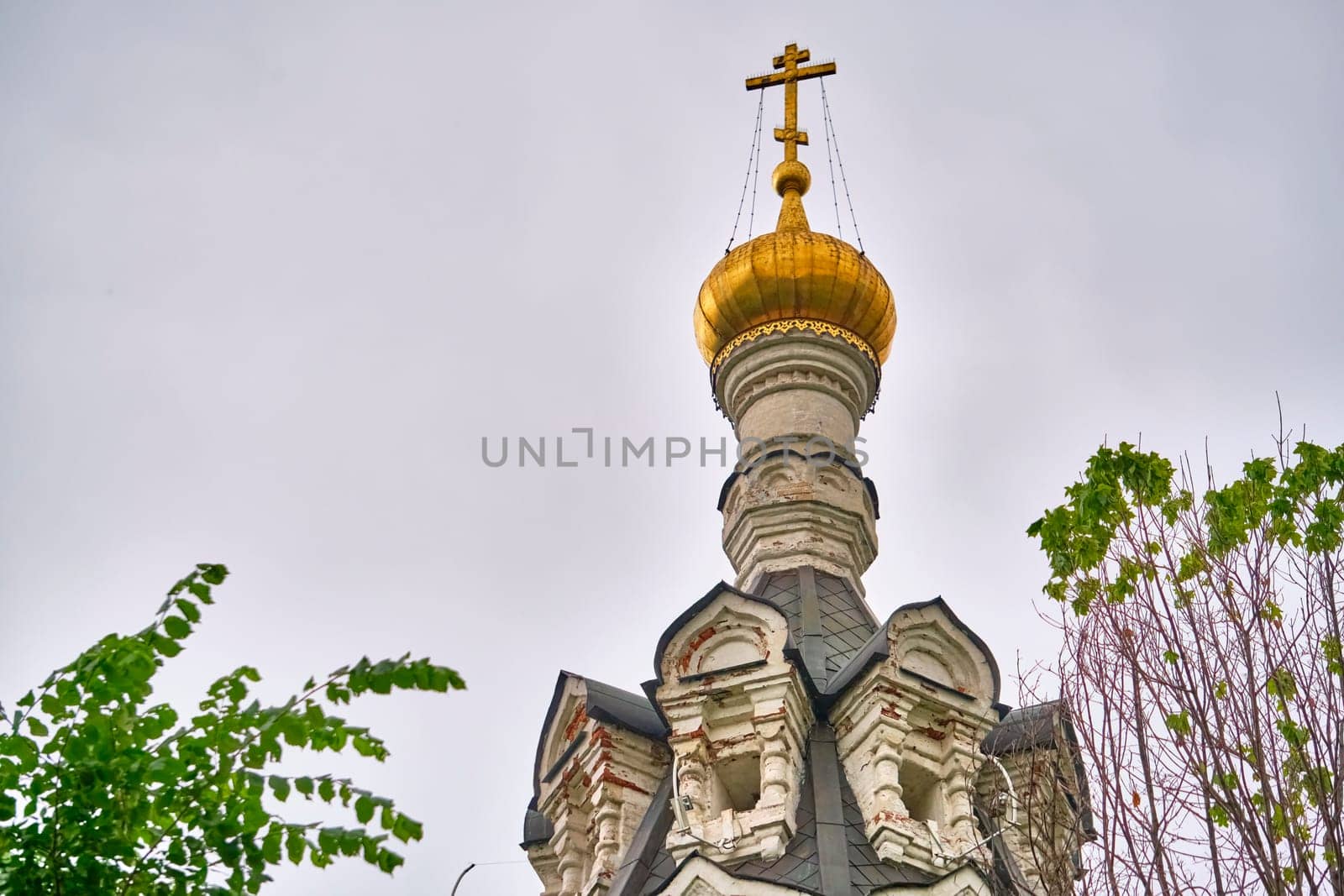 Russia-2020. Church domes of the Orthodox Church behind the trees. general plan. daylight color by lempro