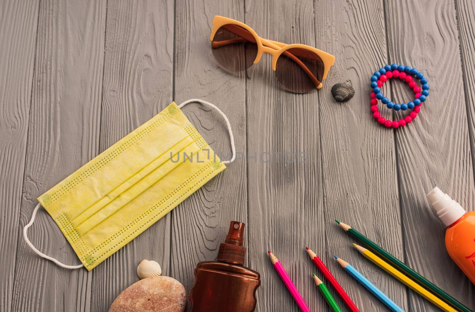 New normal covid-19 face mask sun protection sunglasses accessories sunscreen spray lotion tan ultra-violet rays. Summer background template mockup free space composition sample text. Top view above
