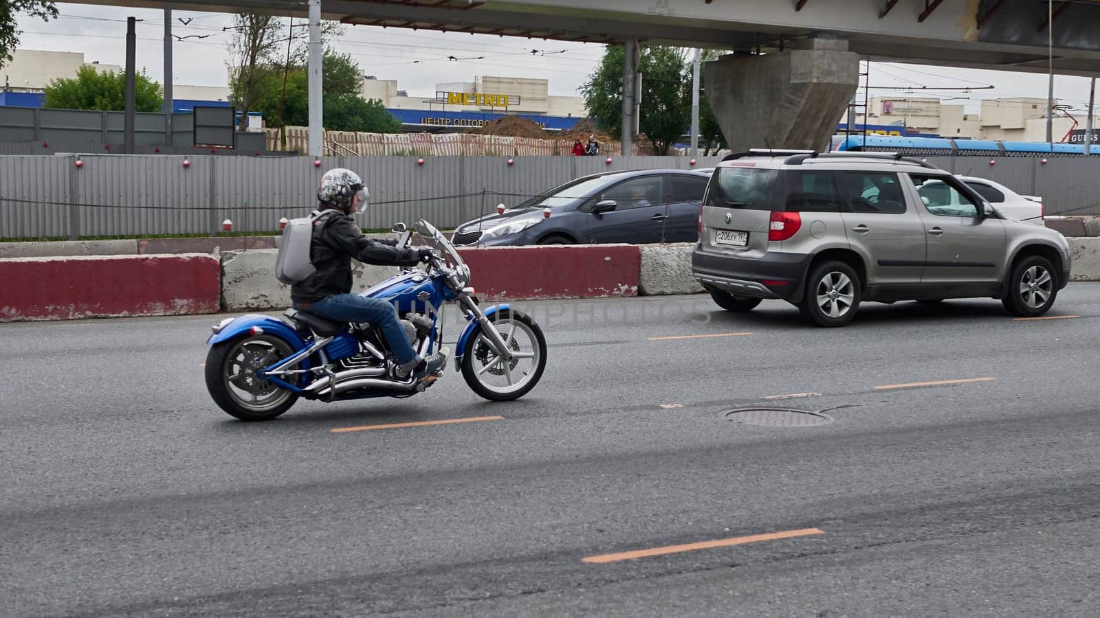 moscow russia 2020. a motorcyclist rides in traffic. color by lempro