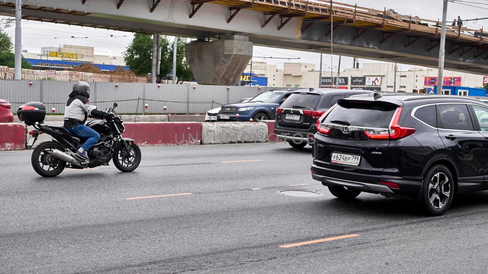 moscow russia 2020. a motorcyclist rides in traffic. color by lempro