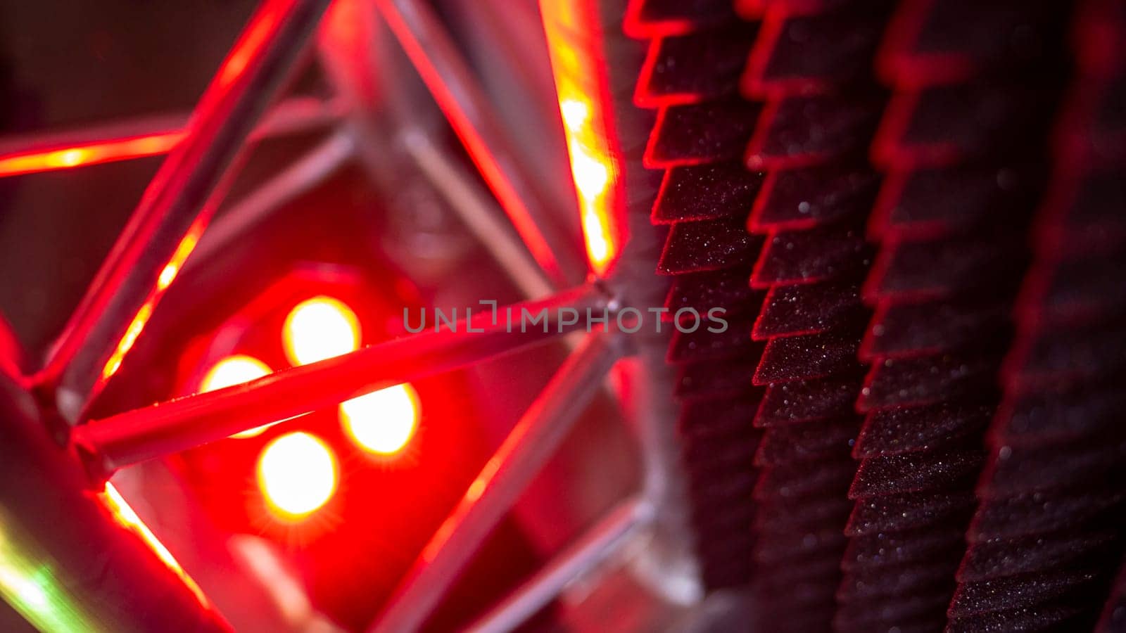 aluminum truss for lighting equipment illuminated with red light. color by lempro