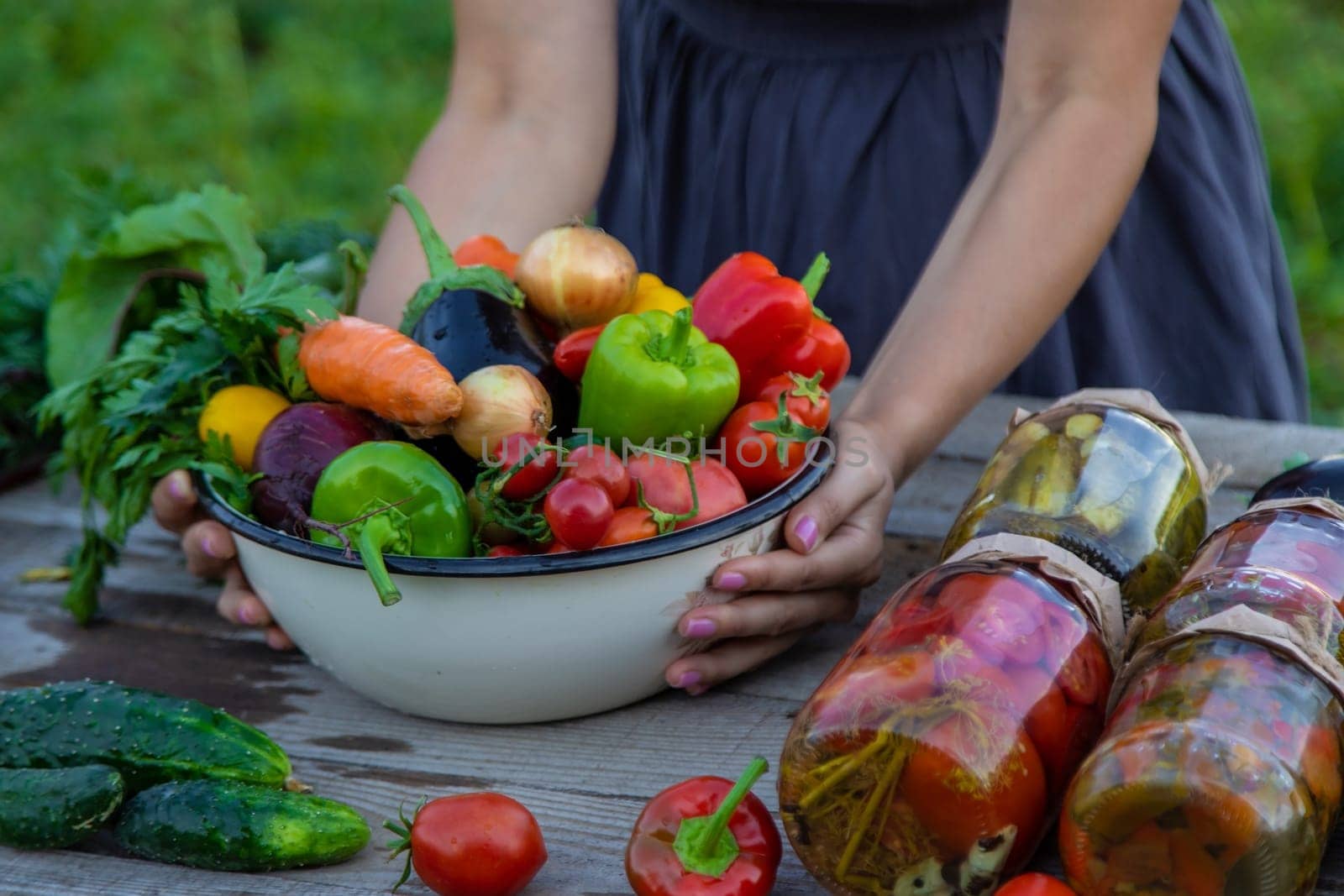 woman in the garden with vegetables in her hands.