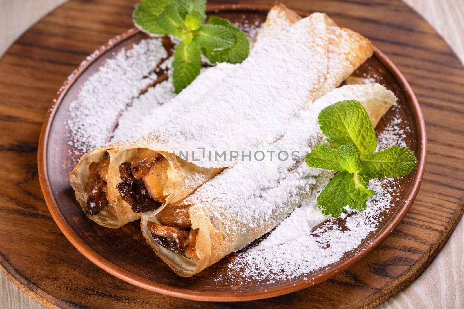 Homemade thin crepe (pancakes) with apple filling by Apolonia